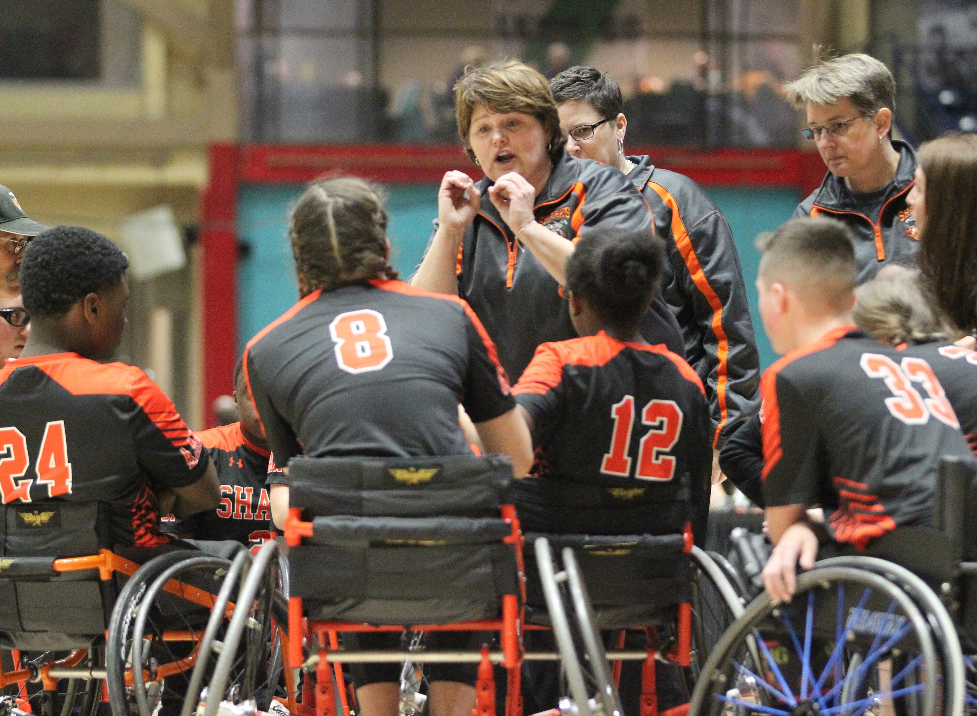 Houston Sharks coach Christy Jones talks to her team in the first half of the GHSA wheelchair state title game at the Macon Centreplex, Friday March 6, 2020, in Macon. Tami Chappell for the Atlanta Journal Constitution