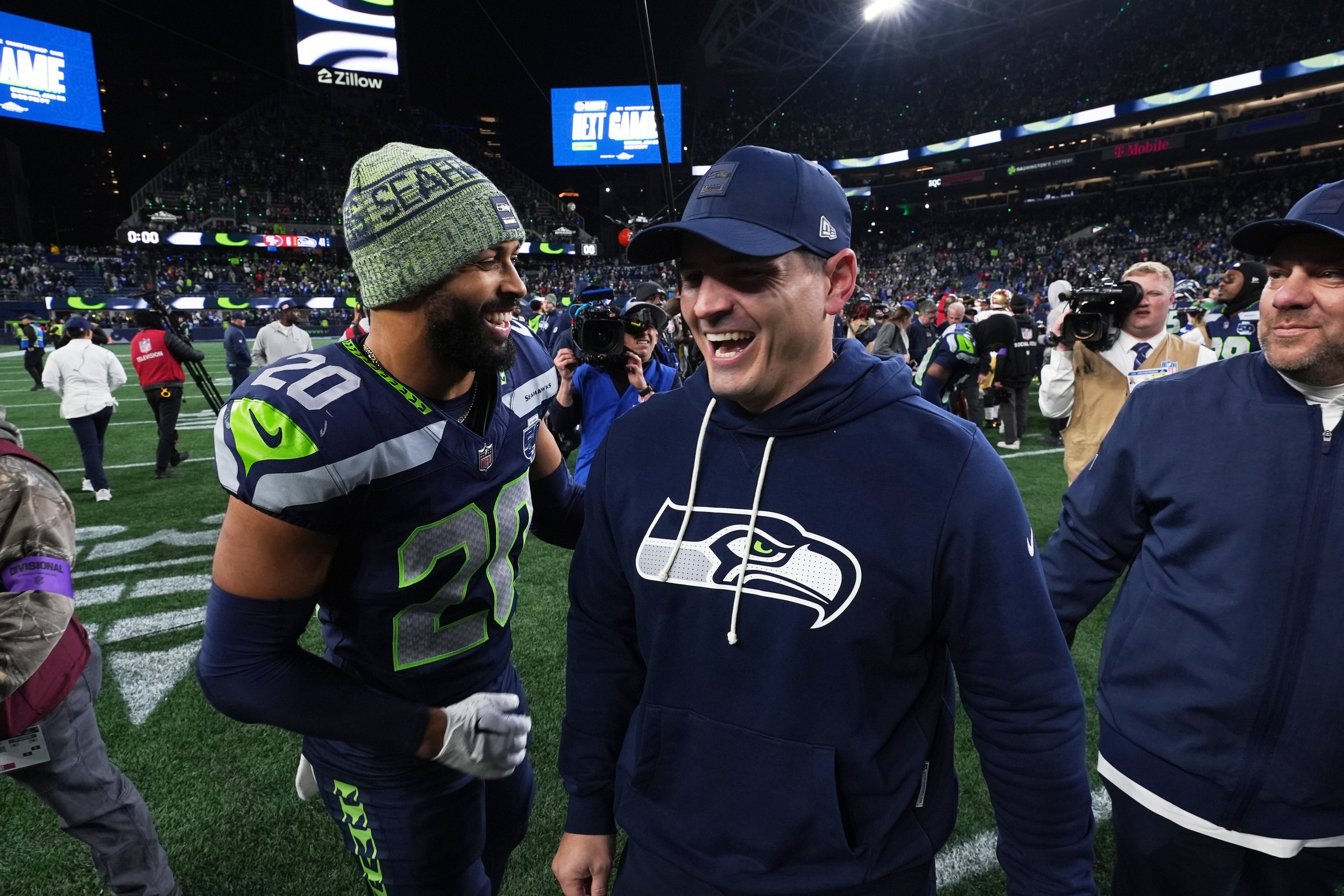 Seahawks safety Julian Love (left) speaks with head coach Mike Macdonald after their divisional playoff game against the 49ers on Saturday, Jan. 17, 2026, in Seattle. (Lindsey Wasson/AP)