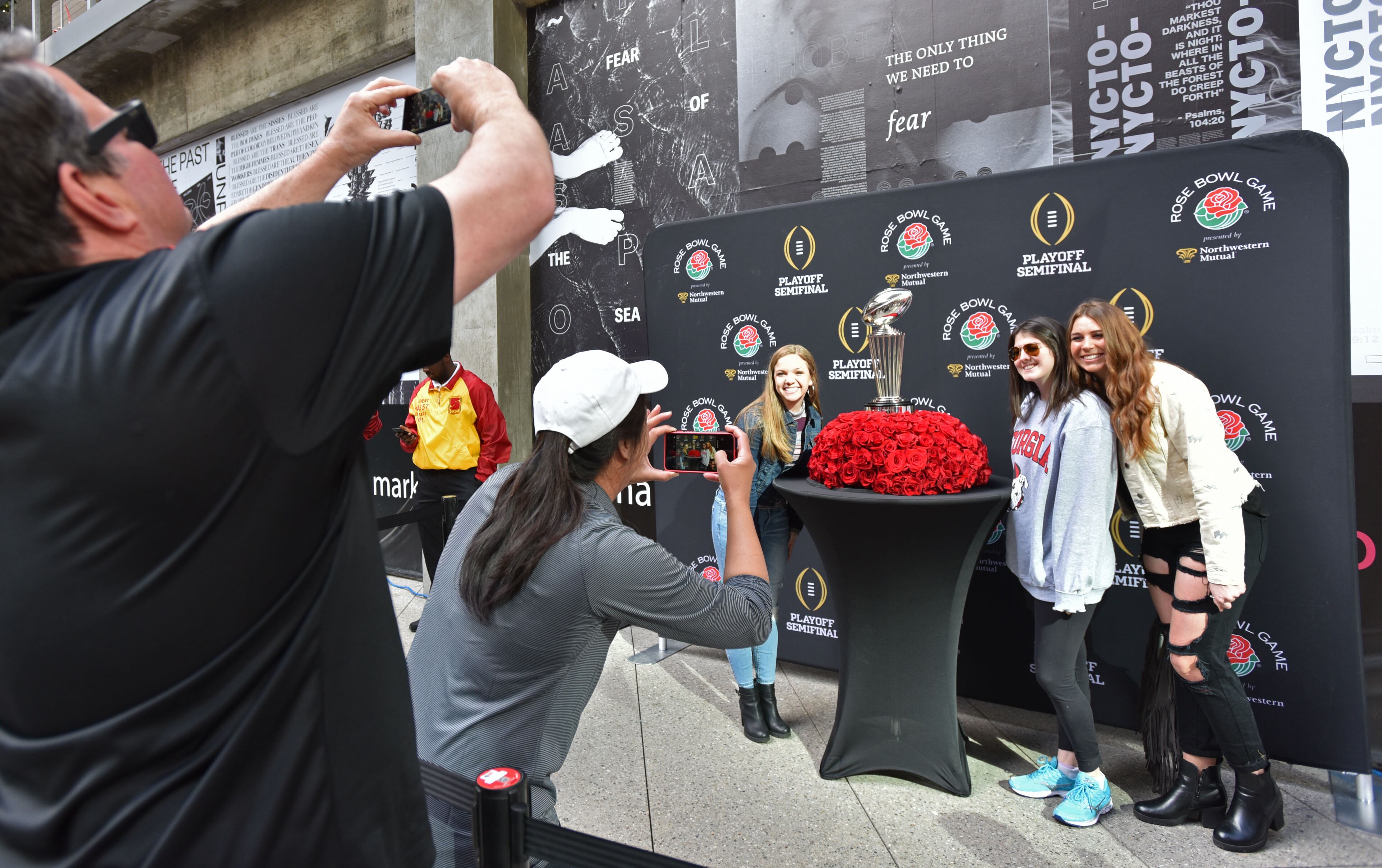 December 31, 2017 Los Angeles, California - Connor Flagel (center), of Marietta, plays a game of corn hole during the Rose Bowl Bash in downtown Los Angeles on Sunday, December 31, 2017. Hyosub Shin / hshin@ajc.com
