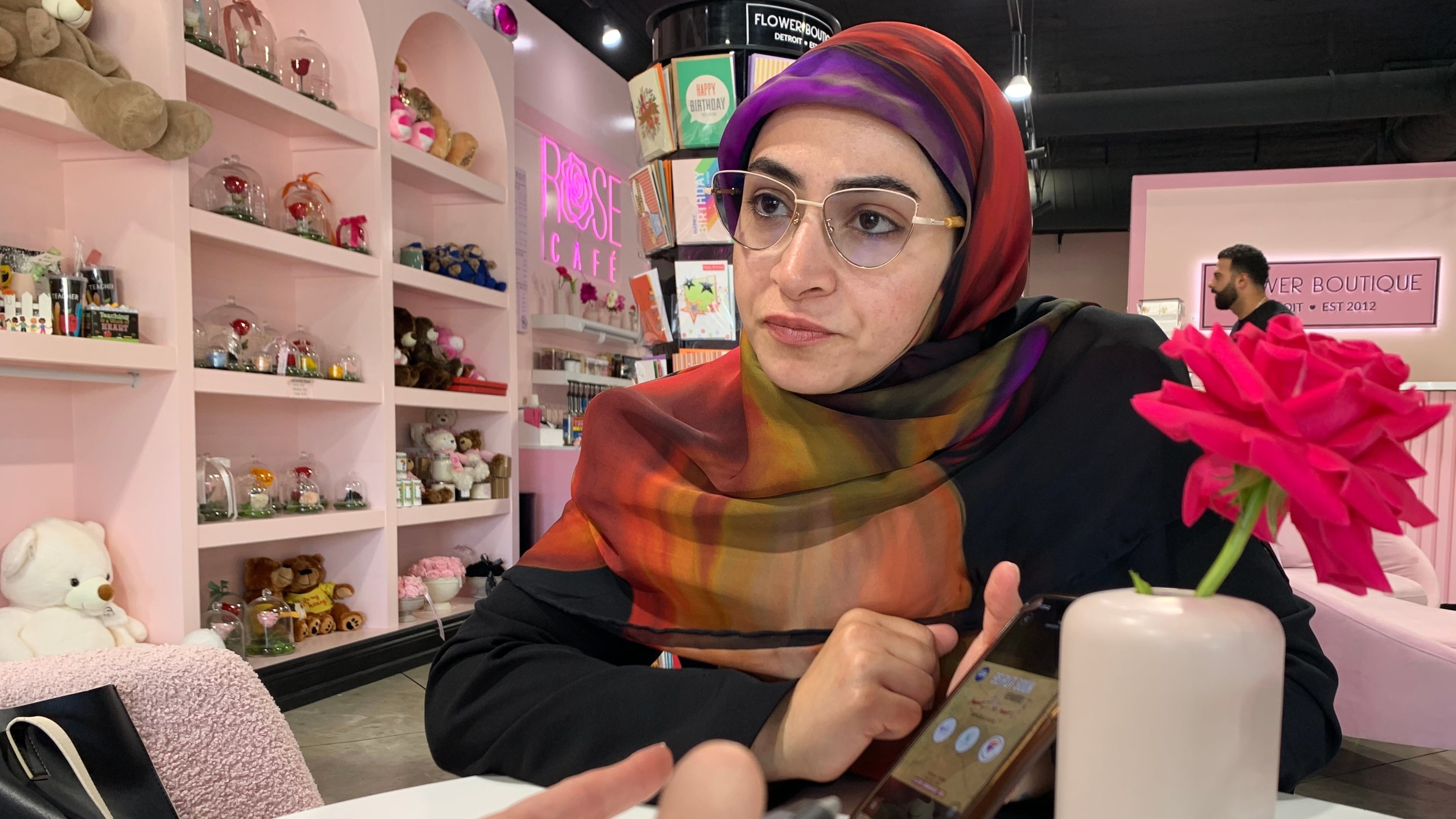 Marwa Mussa discusses plans for a fundraiser while seated at a coffee shop on May 29, 2026, in Dearborn, Mich. (AP Photo/Mike Householder)