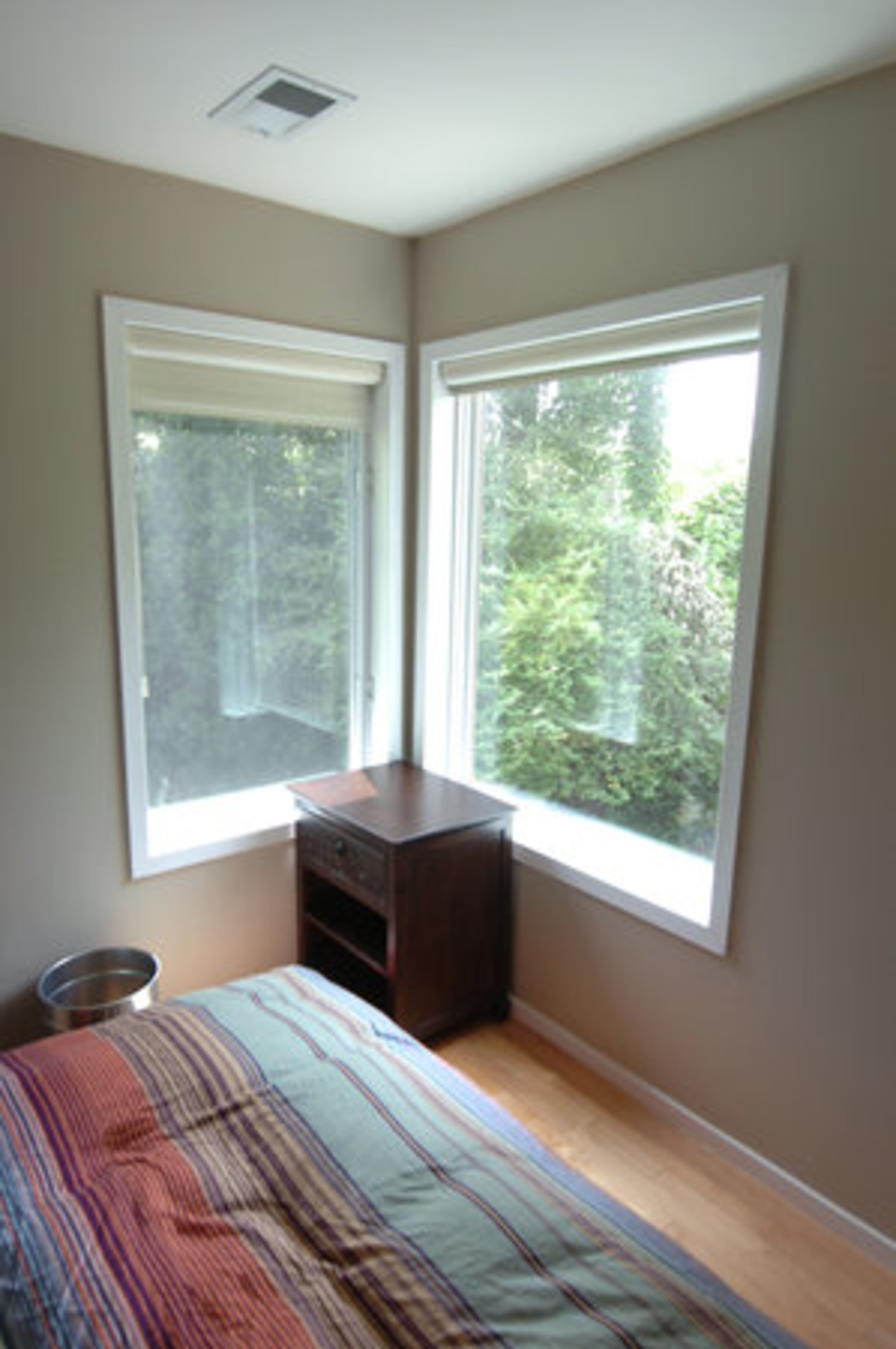 The sleeping level includes a guest room with two corner windows and a full bath.