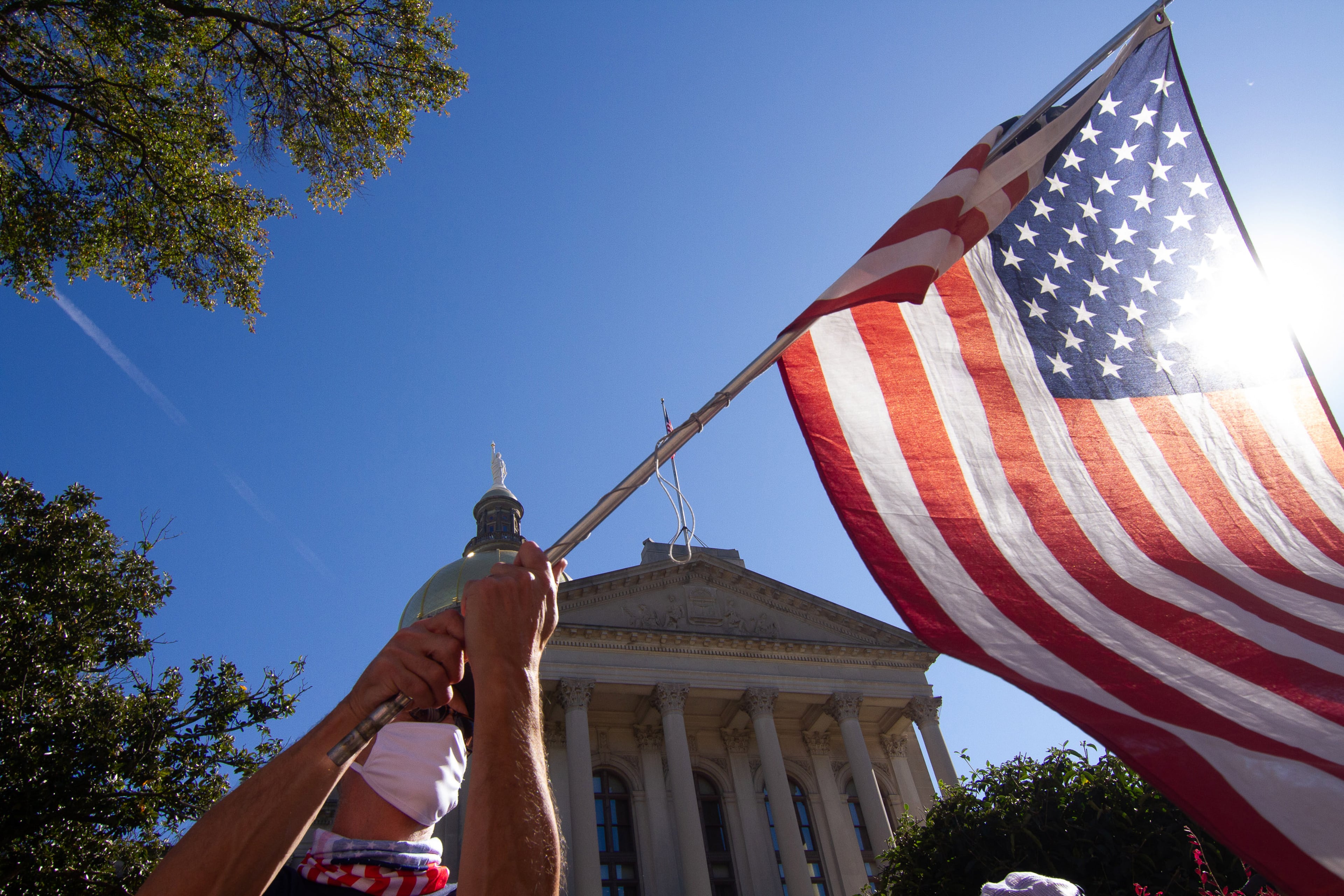 Protesters in support of President Trump demonstrate against the election results along Martin Luther King Jr. Drive in front of the state Capitol in Atlanta on Saturday, November 14, 2020. (Photo: Steve Schaefer for The Atlanta Journal-Constitution)