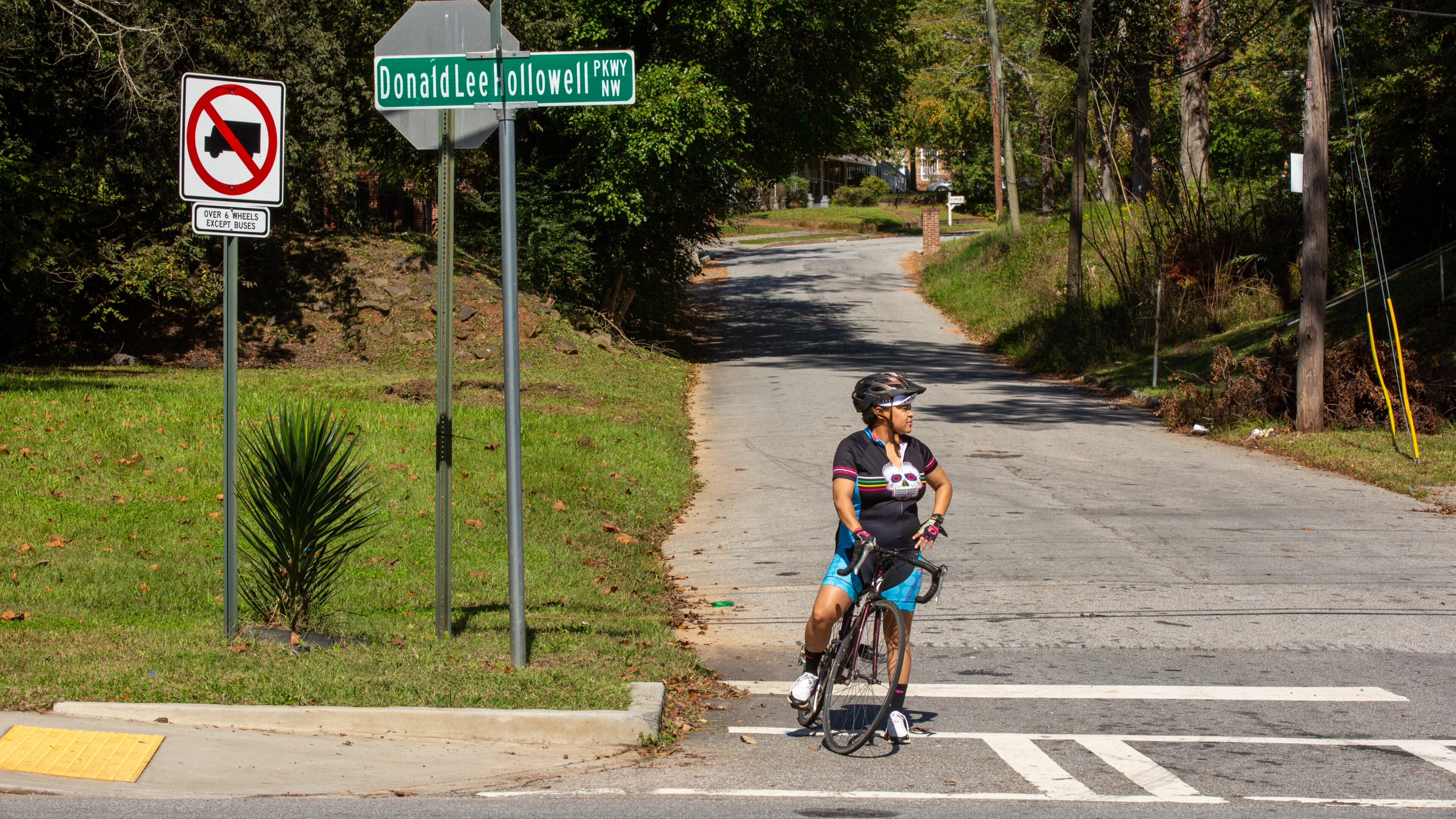 Rolanda Powell waits to merge onto Donald Lee Hollowell Parkway from Center Hill Avenue in Atlanta, Georgia, on Tuesday, October 13, 2020. Rolanda Powell, head of her neighborhood organization, has been raising concerns about the safety of Donald Lee Hollowell Parkway following several recent fatalities. (Photo/Rebecca Wright for the Atlanta Journal-Constitution)