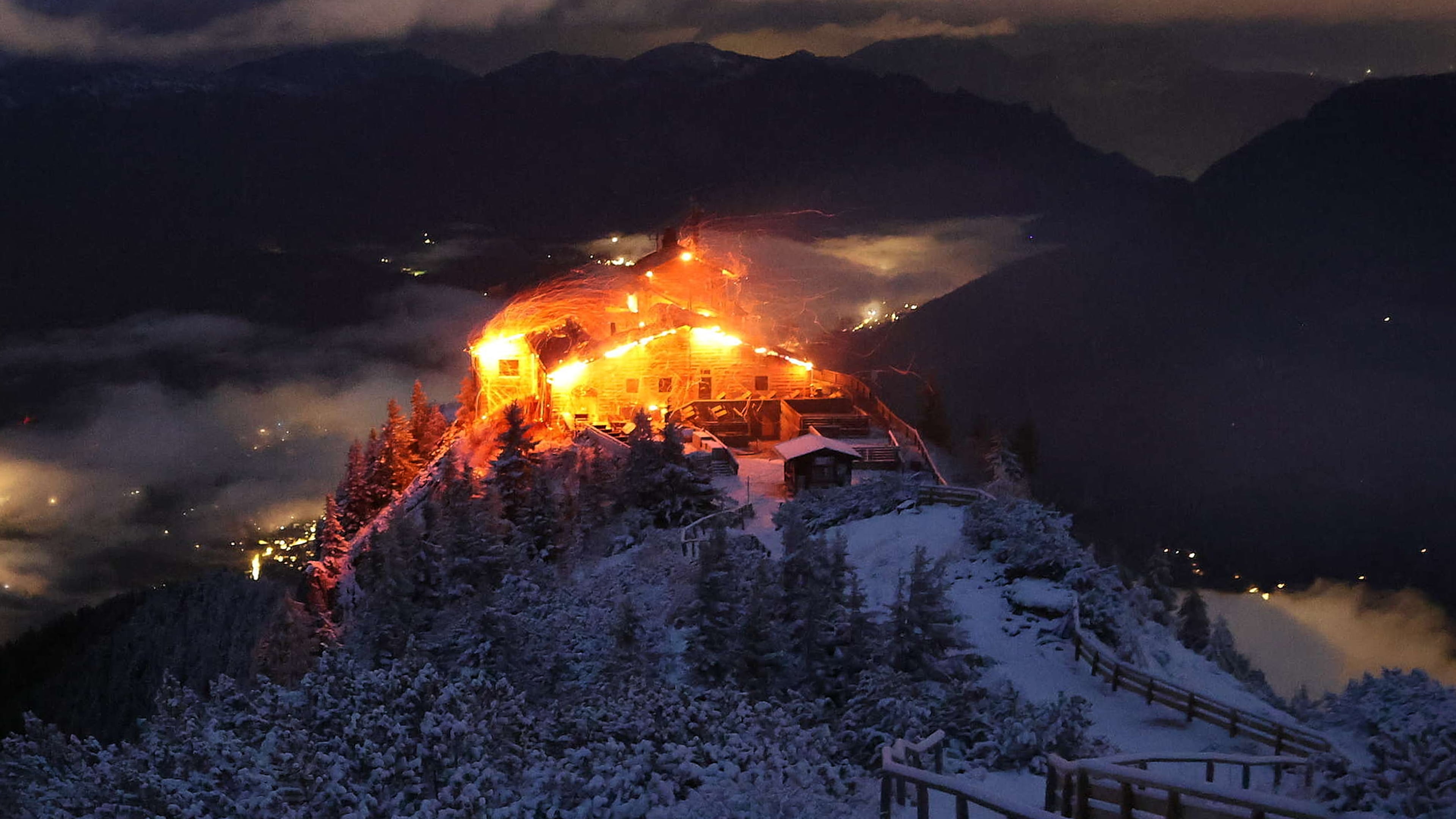 This image distributed by the 'Bergerlebnis Berchtesgaden' shows a building known as the Eagle's Nest built for Adolf Hitler in the Bavarian Alps on fire early Saturday, Oct. 24, 2026. (Bergerlebnis Berchtesgaden via AP)
