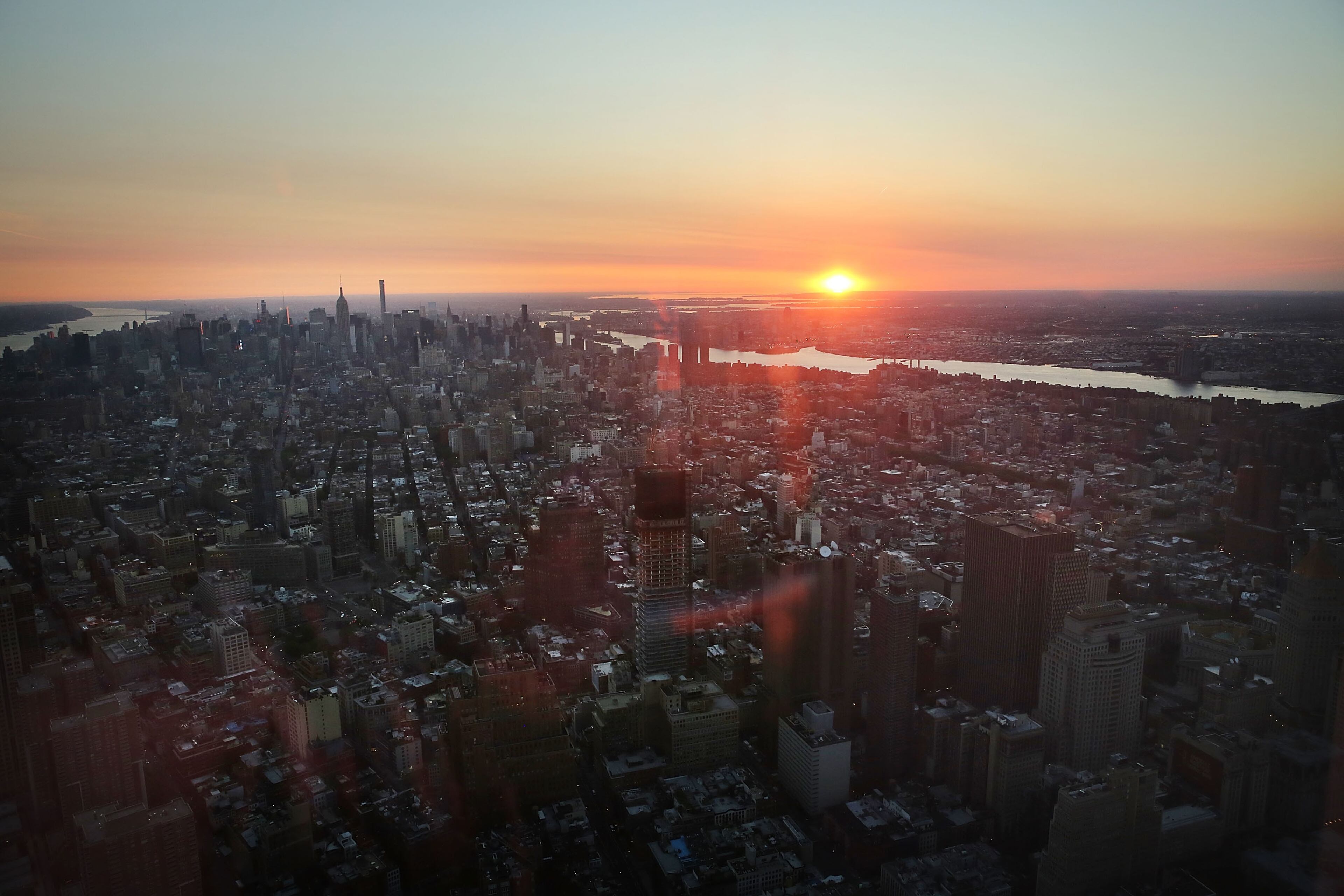 NEW YORK, NY - MAY 29: Manhattan is viewed at dawn from the newly built One World Observatory at One World Trade Center on the day it opens to the public on May 29, 2015 in New York City. The observation deck sits atop the 104-story skyscraper at the former site of the Twin Towers and is expected to become one of Manhattan's top tourist attractions. (Photo by Spencer Platt/Getty Images)