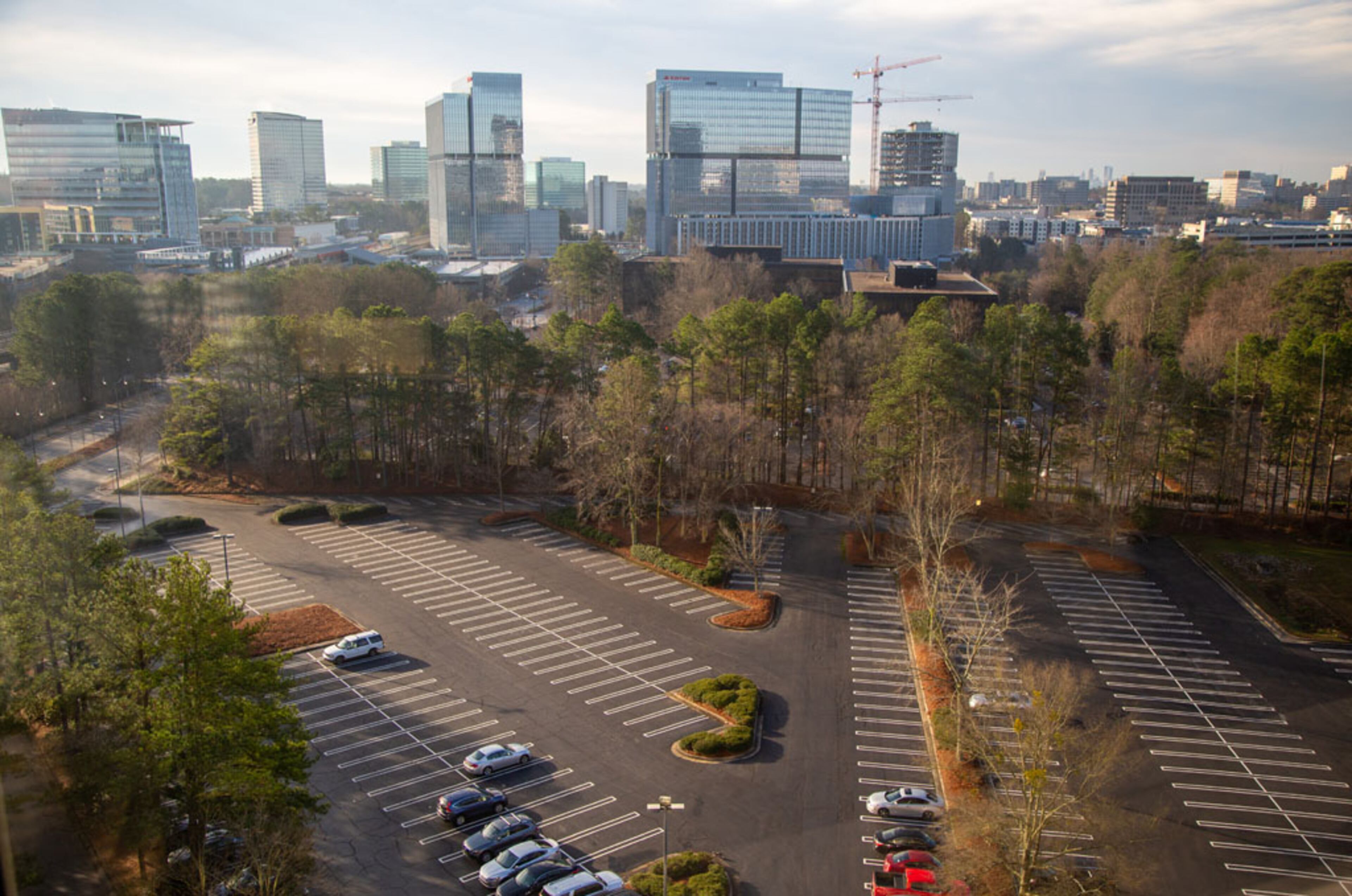 Photo of the area where the High Street project will be developed, from a window of the Experience Center in Dunwoody. The idea for High Street proposed in Dunwoody has languished for more than 10 years, but construction is finally expected to start this year. The Boston-based developers recently got the required special land use and land disturbance permits from the city as the plans for High Street come into view a little more. They also got a tax break from the city's development authority. They hope for it to be like Avalon and the Battery - a retail, entertainment and office hub that would create a true "downtown" for the Perimeter Center area.. (Photo by Phil Skinner)