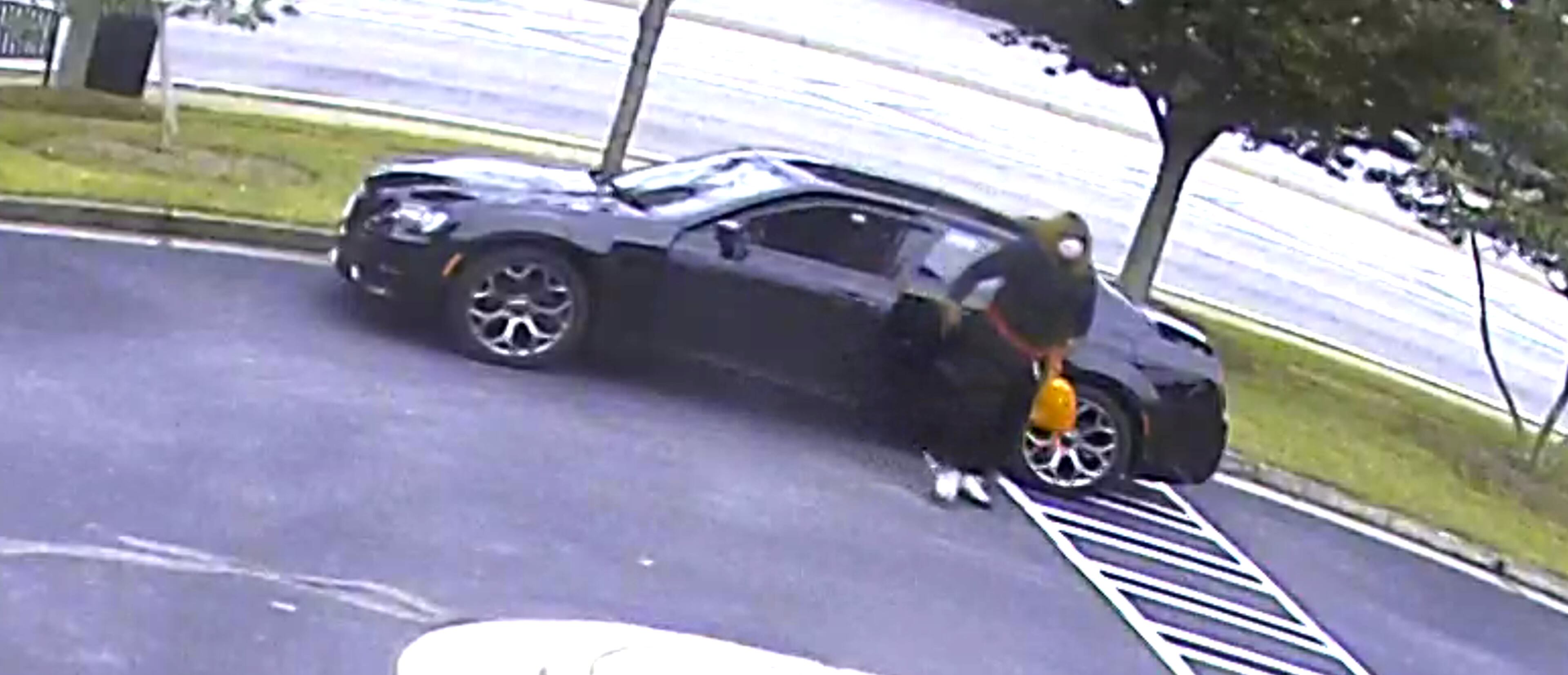 The serial bank robber drives what appears to be a newer model Chrysler 300 with chrome rims.