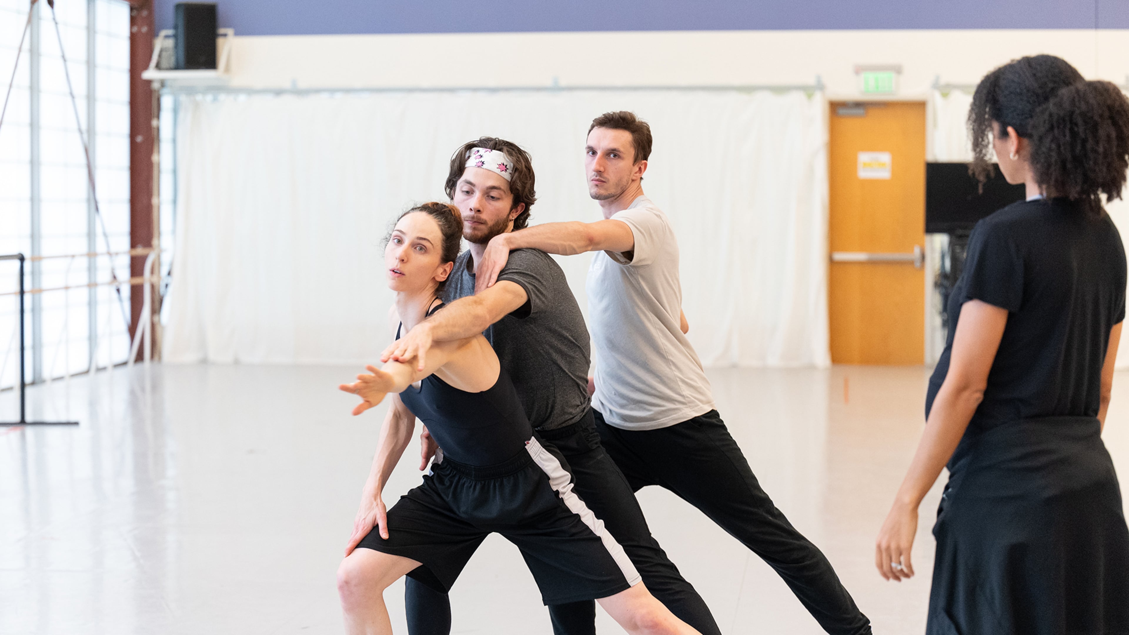 Atlanta Ballet Choreographer-in-Residence Claudia Schreier, right, coaches dancers Ashley Wegmann, Spencer Wetherington and Marius Morawski in a rehearsal for "Nighthawks."
(Courtesy of Shoccara Marcus)