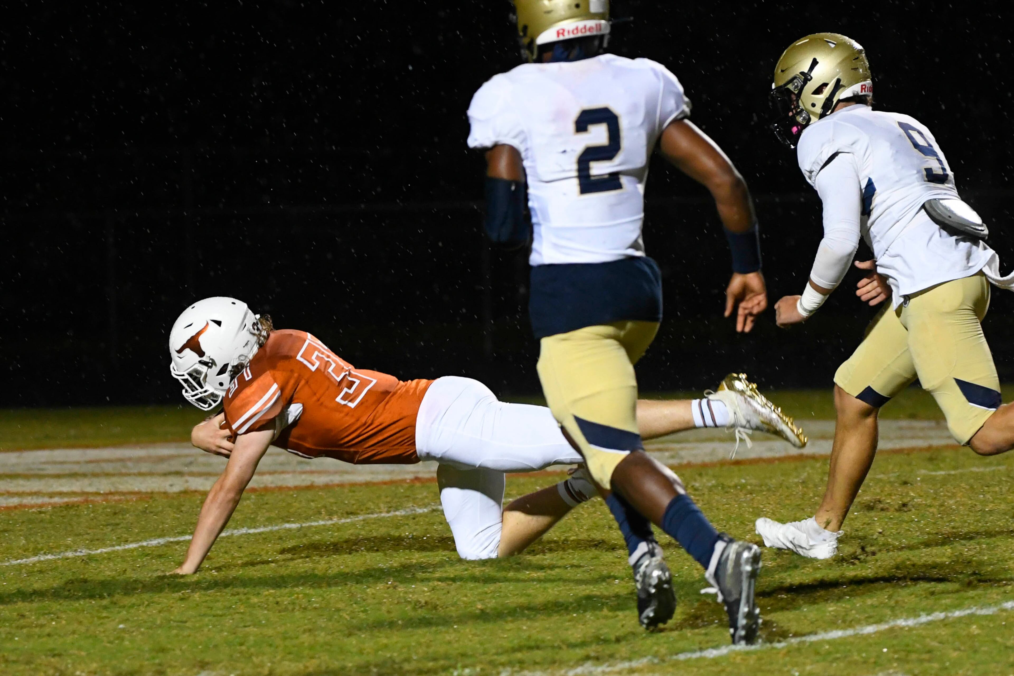 Lanier's Matthew Laughlin can’t make it to the goal line as Dacula's Kaleb Edwards (2) and Blaine Jenkins (9) give chase after Laughlin recovered a turnover during Friday's game.