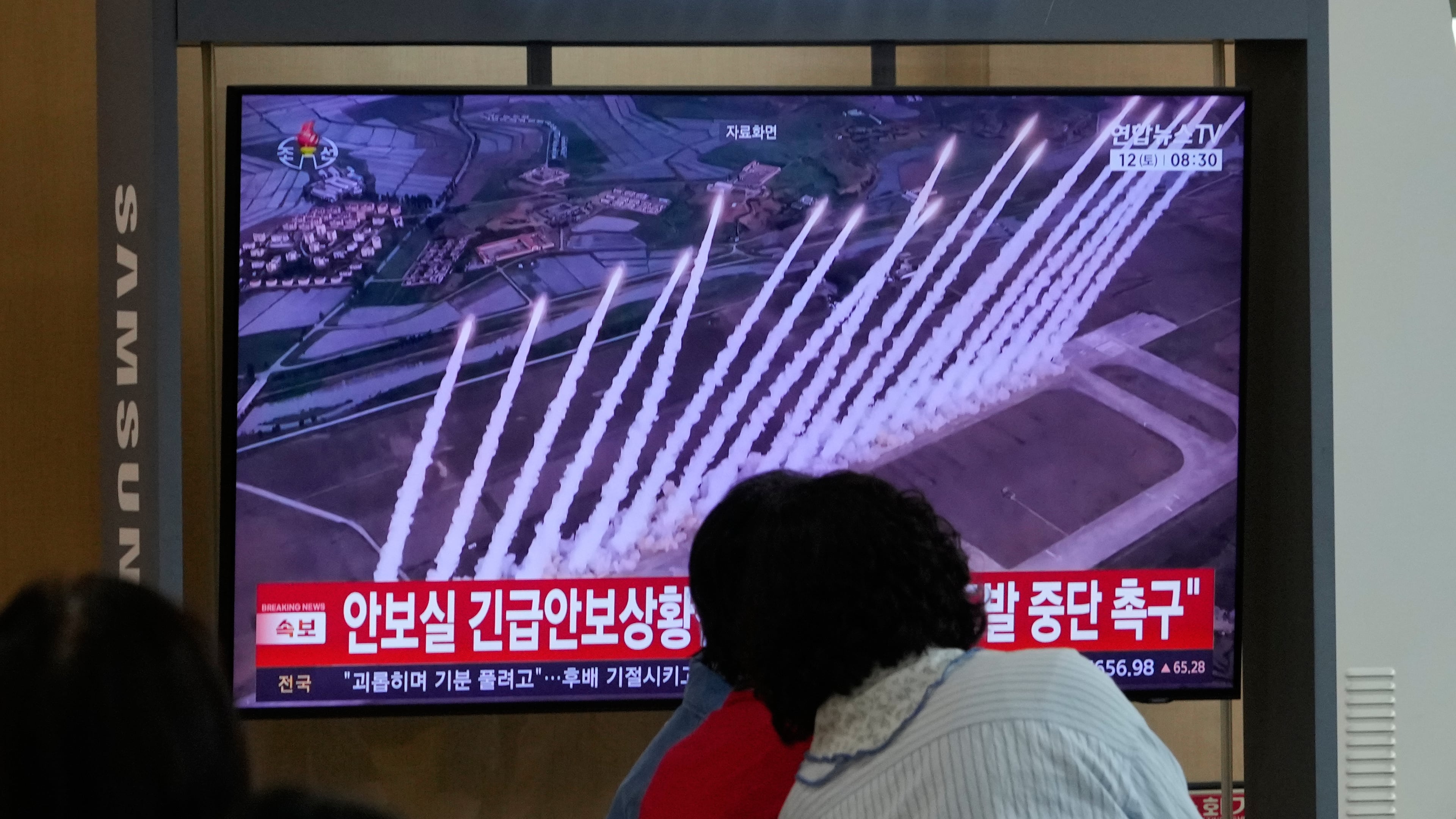 A TV screen shows a file photo of a North Korean missile launch during a news program at Seoul Railway Station in Seoul, South Korea, Saturday, Sept. 12, 2026. (AP Photo/Ahn Young-joon)
