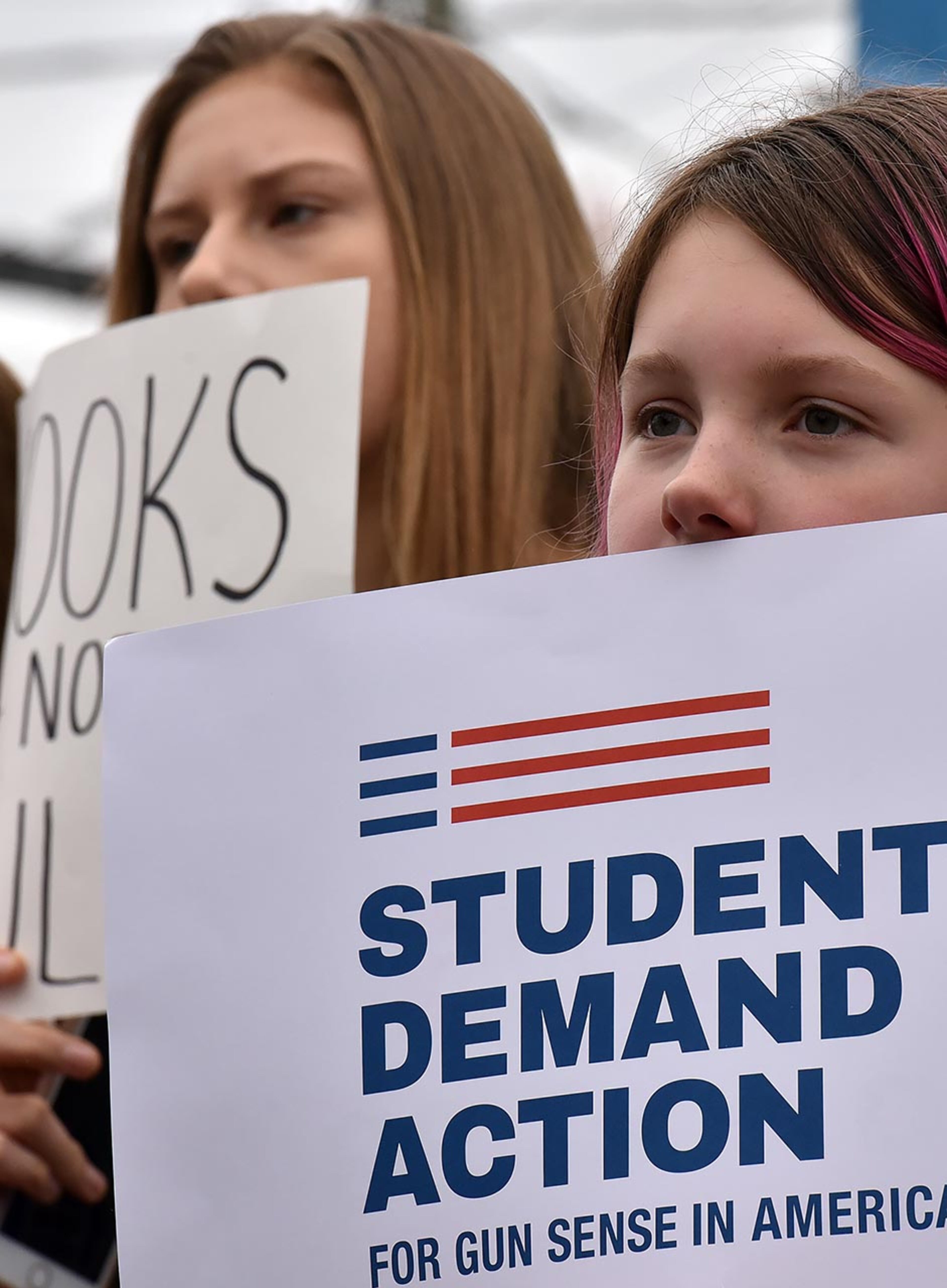 March 24, 2018 Atlanta - People hold signs as they participate in the March For Our Lives rally at the Center for Civil and Human Rights before walking to Liberty Plaza on Saturday, March 24, 2018. Atlanta police estimated the crowd at near 30,000 for todayâÃôs March for Our Lives. People of all ages were drawn to one of the nationwide demonstrations in a movement begun by student survivors of last monthâÃôs mass killing in a Parkland, Fla., school. Some of those Florida students were among the speakers in Atlanta. HYOSUB SHIN / HSHIN@AJC.COM