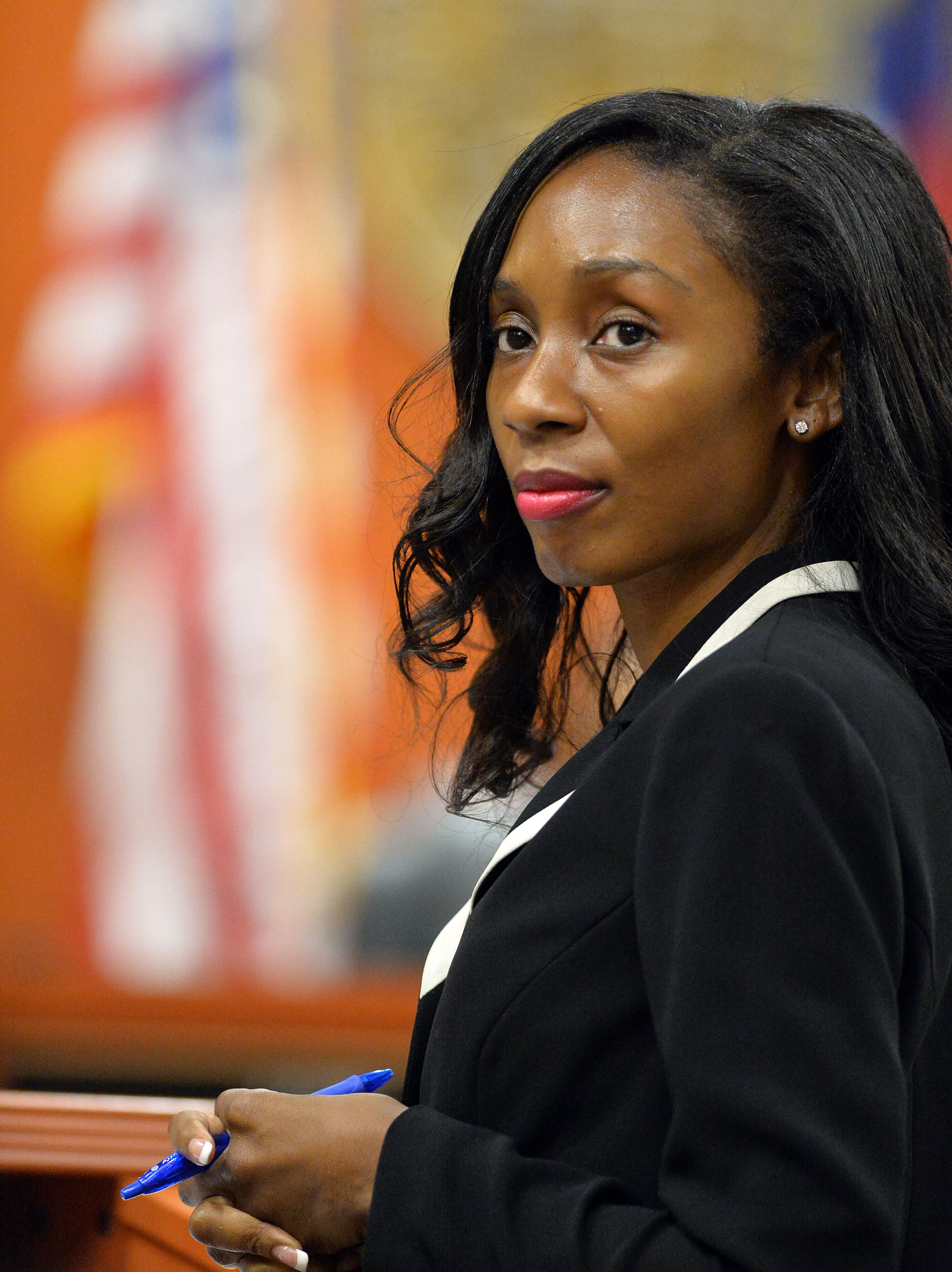 Defense attorney Kemay Jackson listens to an objection by the state during witness testimony. Witness testimony continues for an 8th day during the retrial of embattled DeKalb County CEO Burrell Ellis on corruption charges before DeKalb County Superior Court Judge Courtney L. Johnson, Thursday, June 18, 2015. KENT D. JOHNSON /KDJOHNSON@AJC.COM