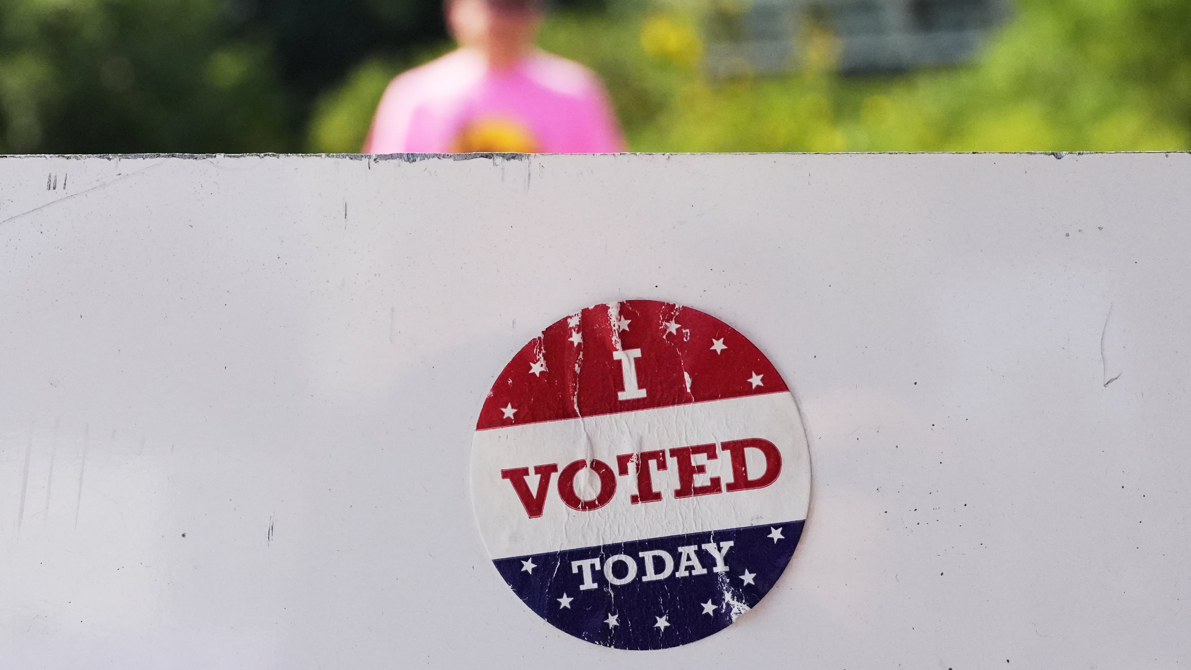 FILE - An, " I Voted Today," sticker is stuck to an information sign at Olbrich Gardens, Aug. 11, 2026, in Madison, Wis. (AP Photo/Nam Y. Huh, File)