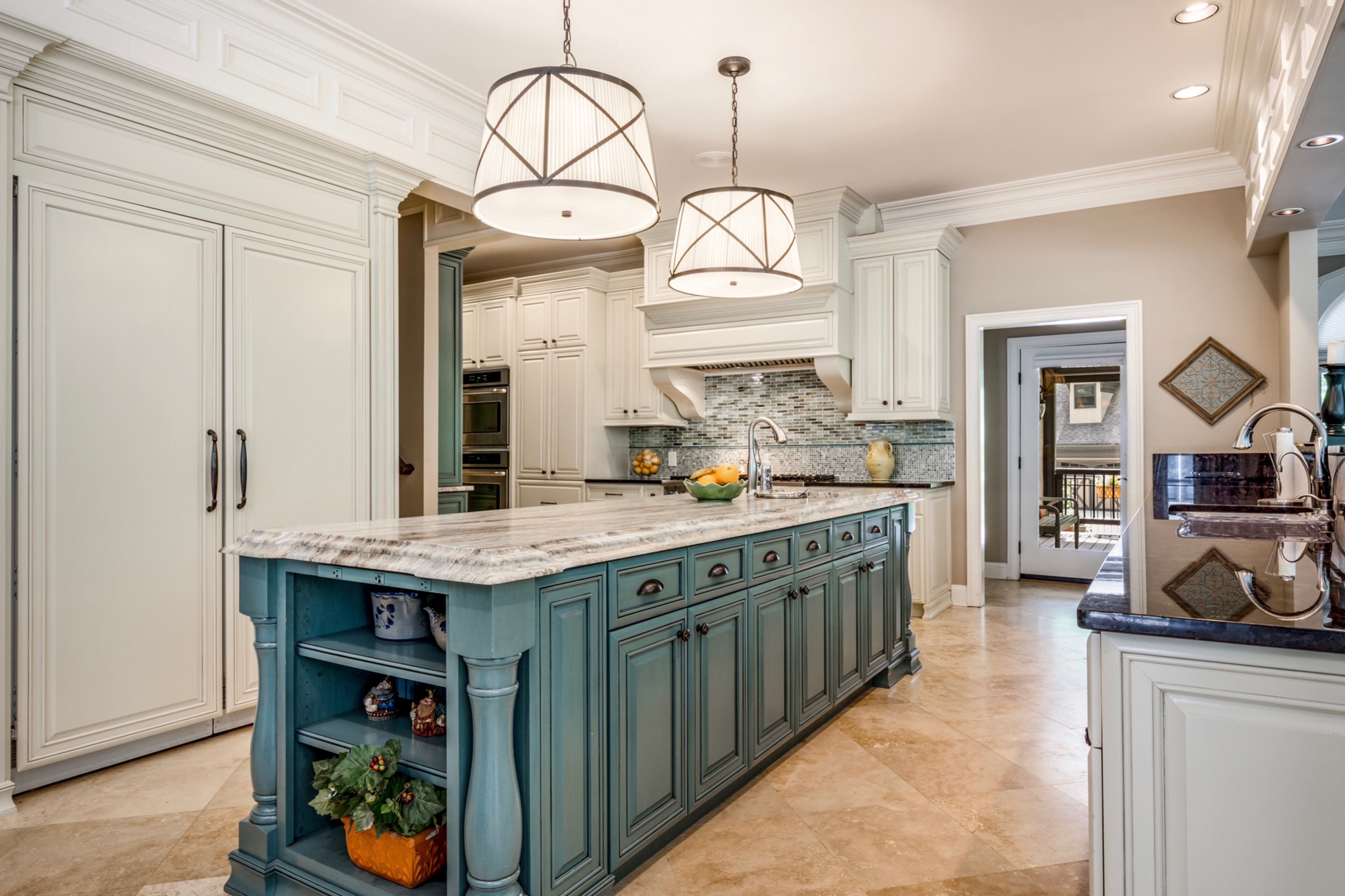 Large kitchen with sub-zero refrigerator, dual dishwashers, large walk-in pantry and all top appliances. Text by Melanie White.