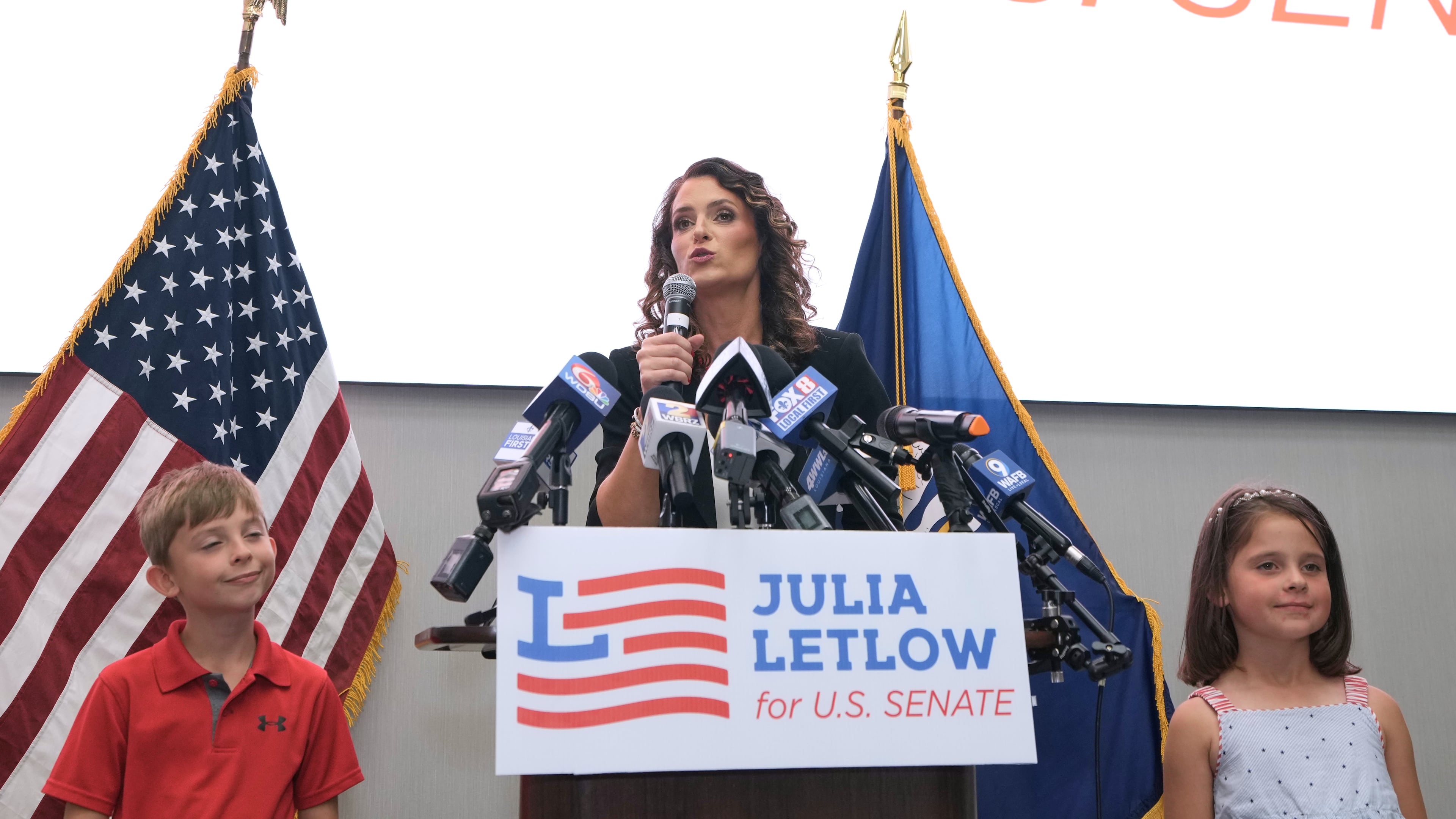 U.S. Senate candidate Rep. Julia Letlow, R-La., speaks to supporters alongside her two children, Jeremiah and Jacqueline, during an election night watch party Saturday, May 16, 2026, in Baton Rouge, La. (AP Photo/Matthew Hinton)