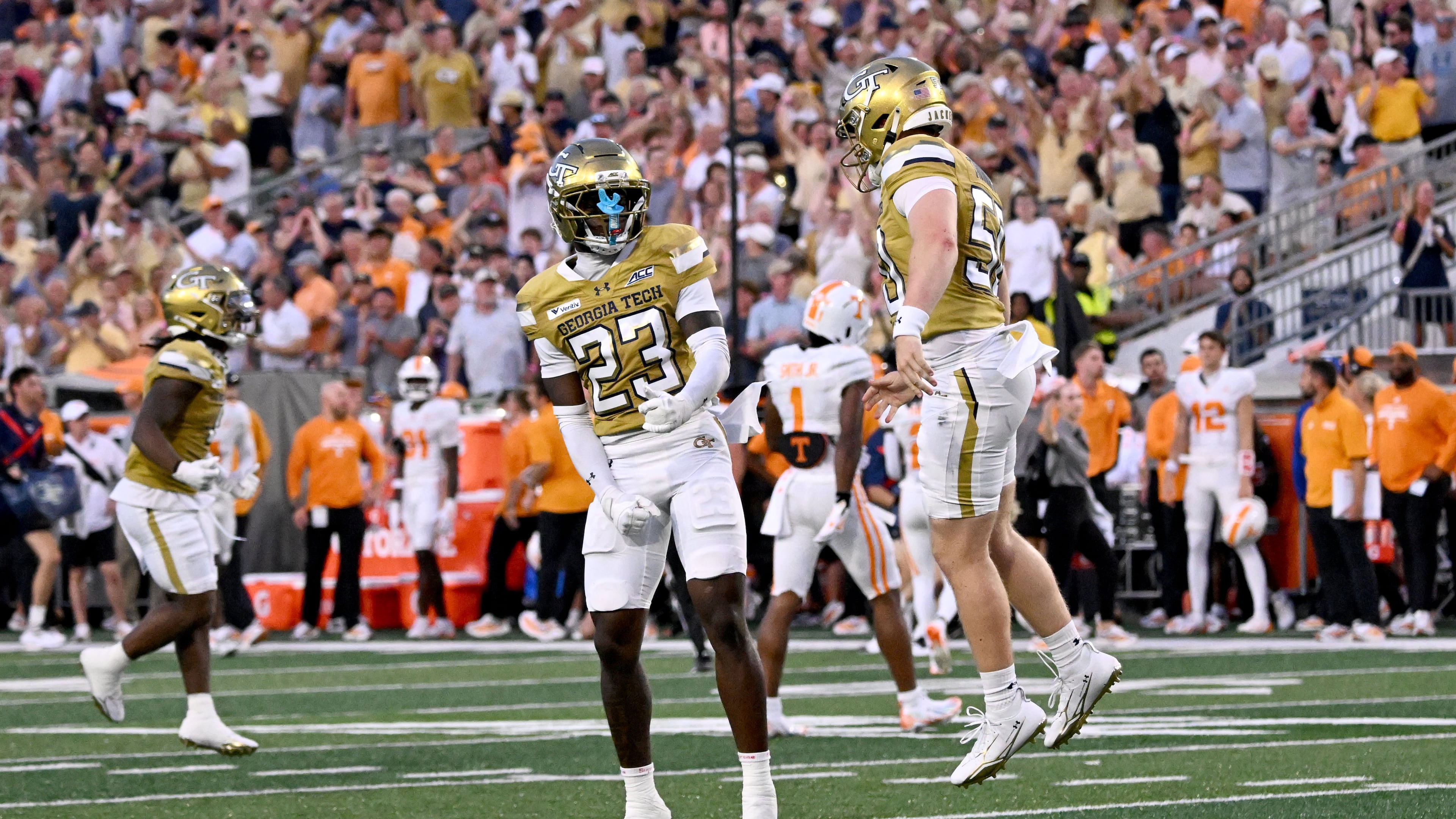Georgia Tech defensive back Trae Stevenson Jr. (23) celebrates after scoring by Georgia Tech defensive back Elgin Sessions (not picgured) during the first half of an NCAA college football game at Bobby Dodd Stadium on Saturday, Sept. 12, 2026, in Atlanta.(Hyosub Shin/AJC)