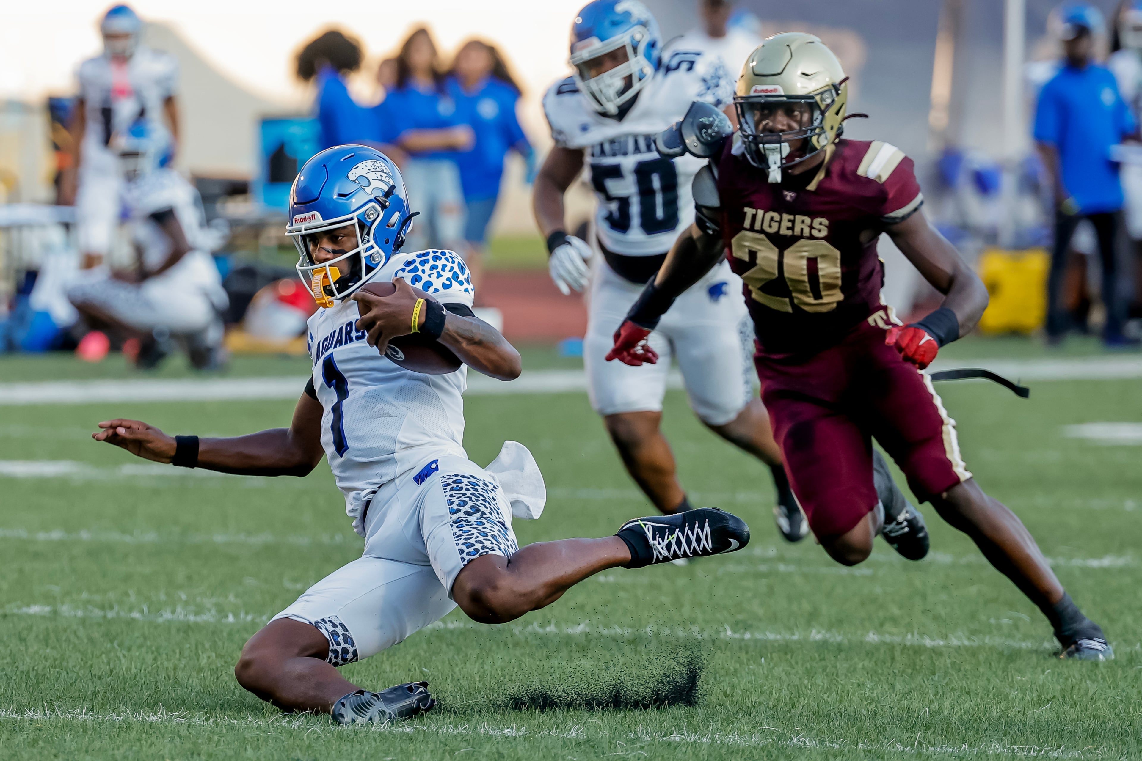 Stephenson quarterback Zabrian Boler (left) scrambles against Tucker’s Jeremiah Tillman during their game at Hallford Stadium on Friday, Sept. 4, 2026, in Clarkston. (Erik S. Lesser for the AJC)