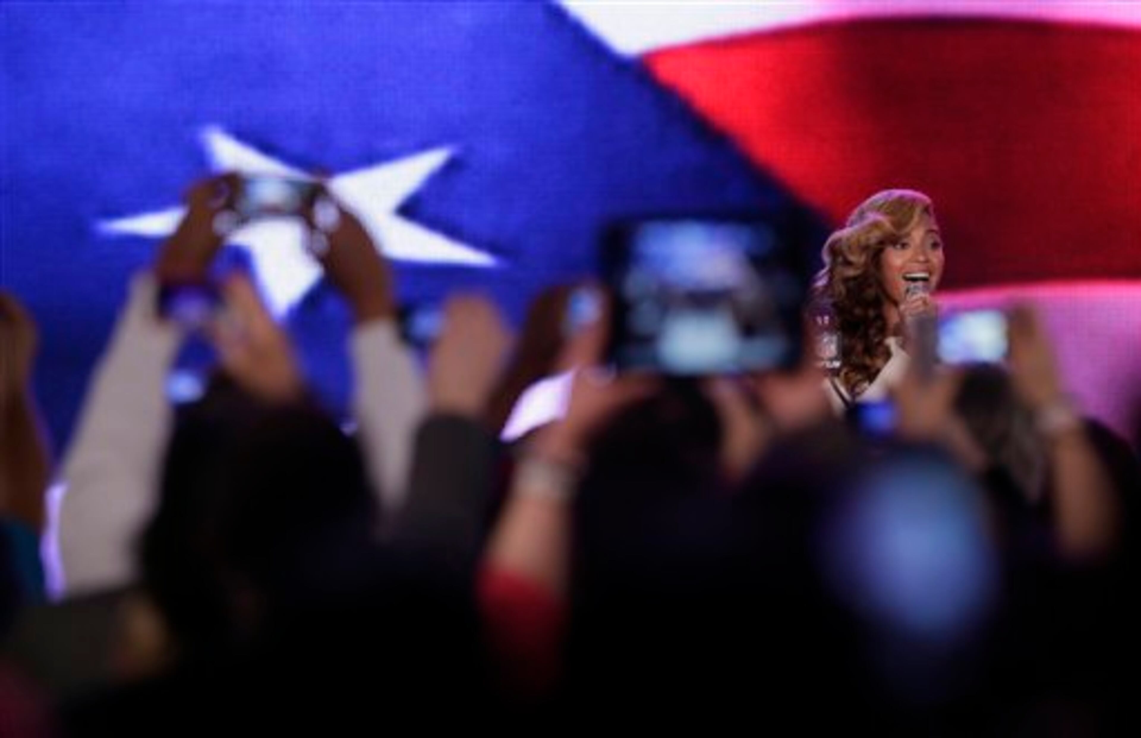 Beyonce sings the national anthem during a news conference Thursday, Jan. 31, 2013, in New Orleans. Beyonce's scheduled to perform during halftime of the NFL Super Bowl XLVII football game on Sunday, Feb. 3, 2013. (AP Photo/Charlie Riedel)