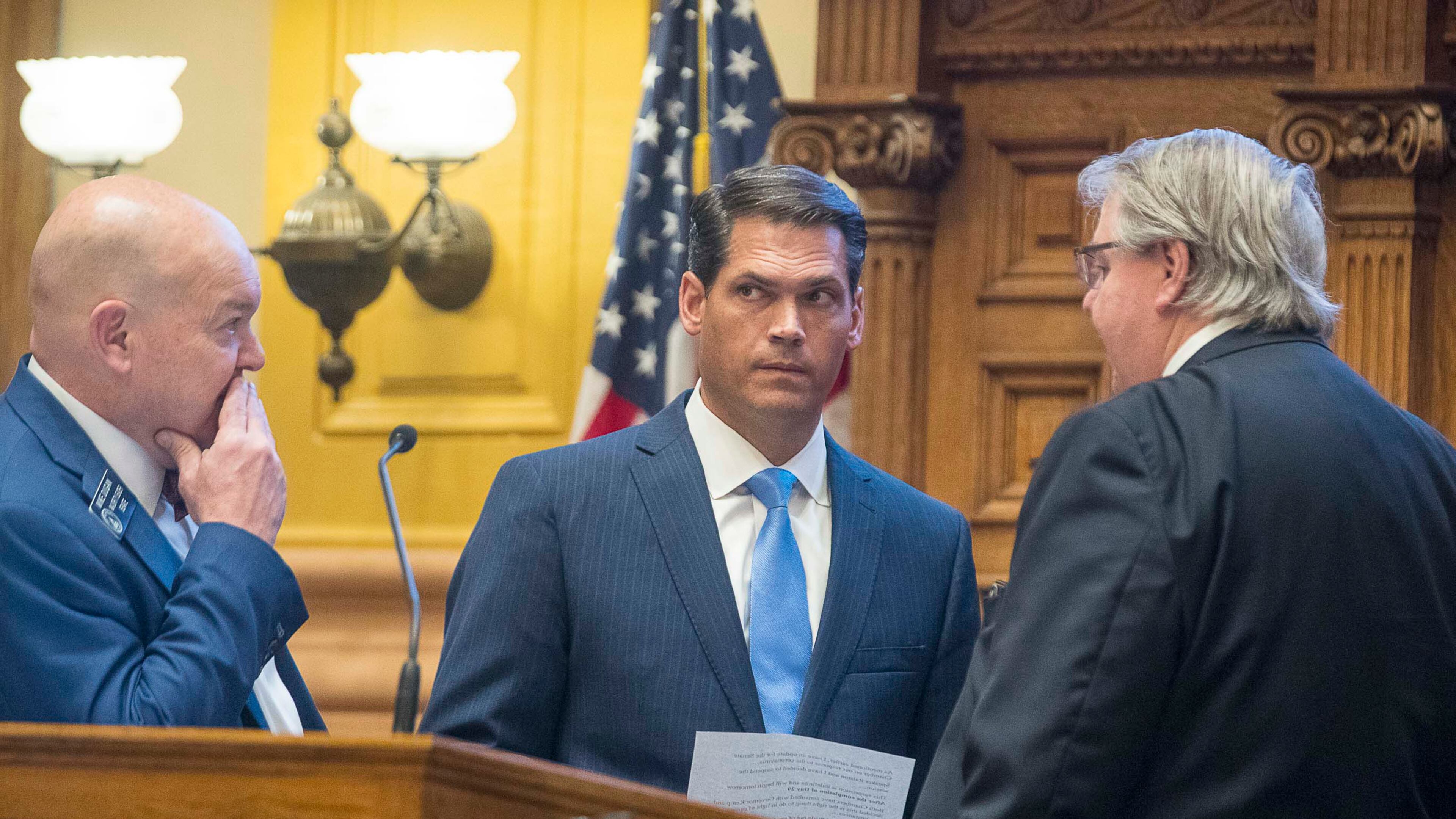 03/12/2020 -- Atlanta, Georgia -- Georgia Lt. Gov. Geoff Duncan (center) speaks with Senate majority leader Mike Dugan (left), R - Carrollton, and Senate minority leader Steve Henson (right), D-Stone Mountain, before presenting a suspension to the legislative session until further notice due to coronavirus during the Georgia Legislatures Crossover day, Thursday, March 12, 2020. (ALYSSA POINTER/ALYSSA.POINTER@AJC.COM)