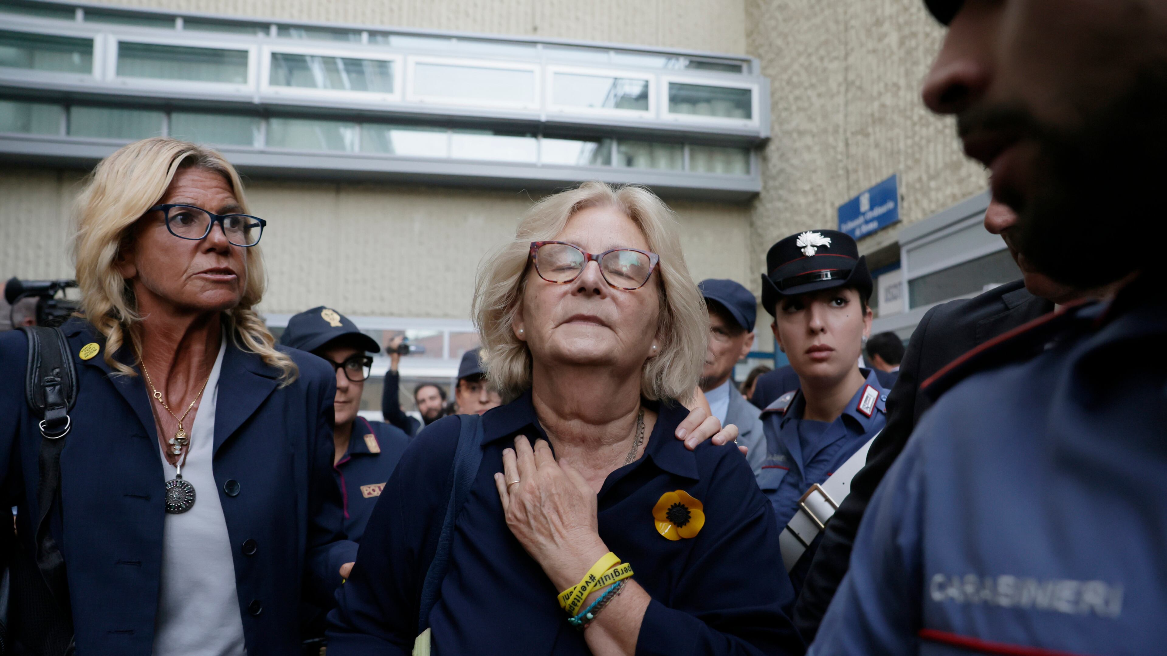 Paola Deffendi, Giulio Regeni's mother, center, reacts with emotion as she leaves a courtroom after three of four Egyptian security officials were convicted to 10 years in prison for the abduction and murder of her son in Cairo in 2016, in Rome, Monday, Sept. 28, 2026. (Cecilia Fabiano/LaPresse via AP)