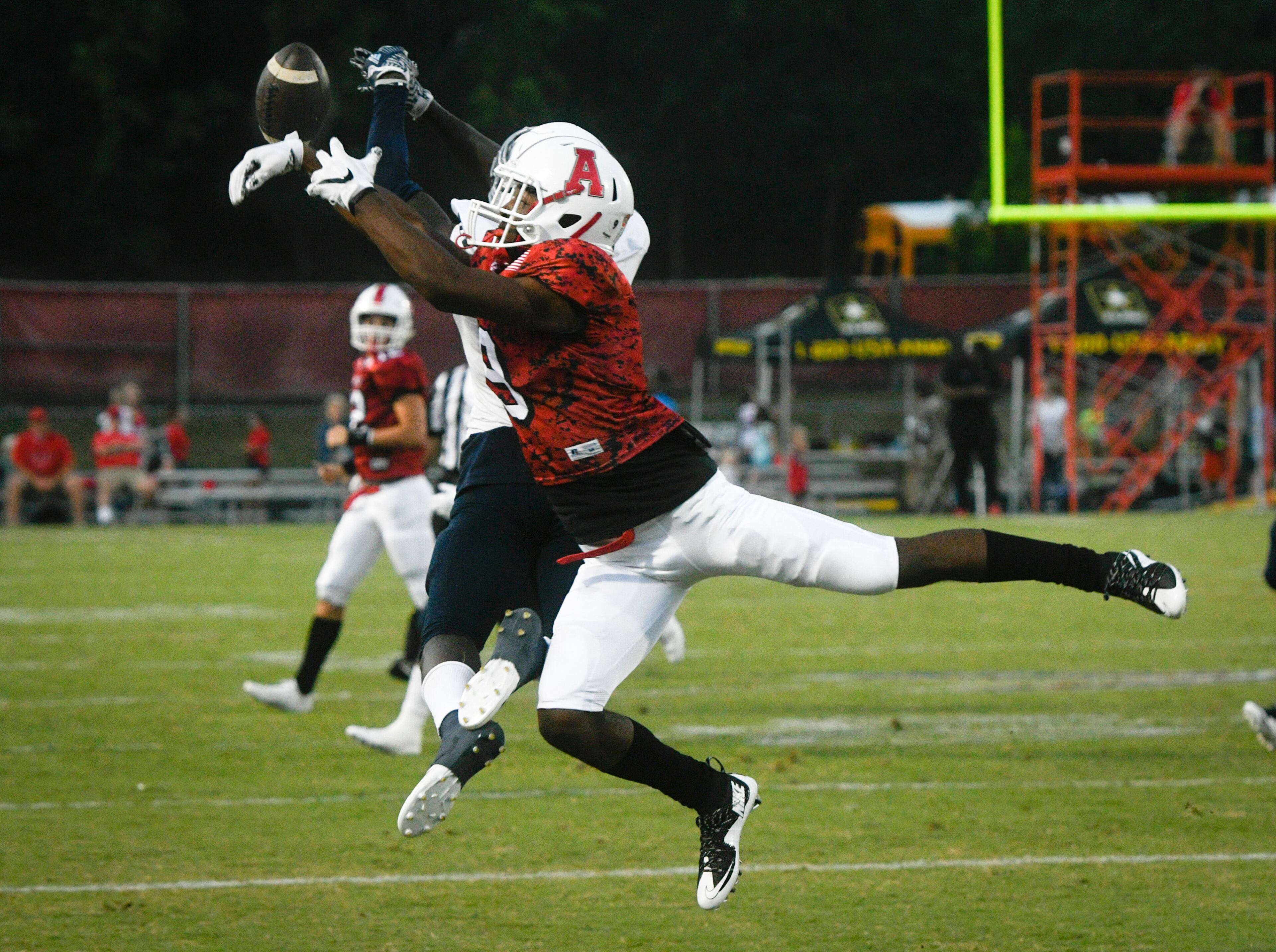 Archer's Jelani Baker can't get a handle on the ball as Norcross's Jaquez Mcwilliams also vies for it during a high school football game, Friday, Sept. 15, 2017, in Lawrenceville. (Special/John Amis)