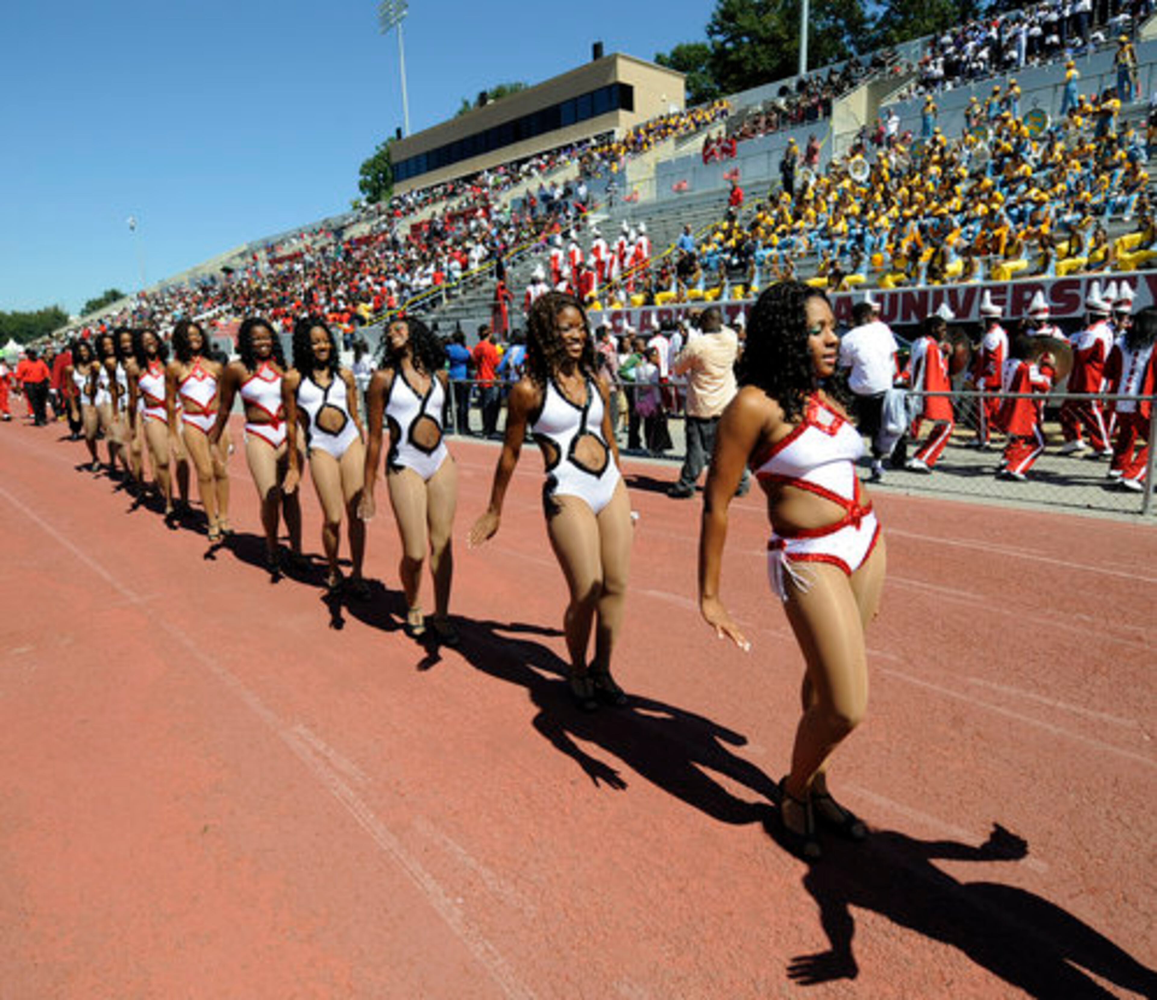 Clark Atlanta's Essence Dancers walk in front of the homecoming crowd at CAU Stadium. Kentucky State spoiled the event by defeating Clark Atlanta 31-13.