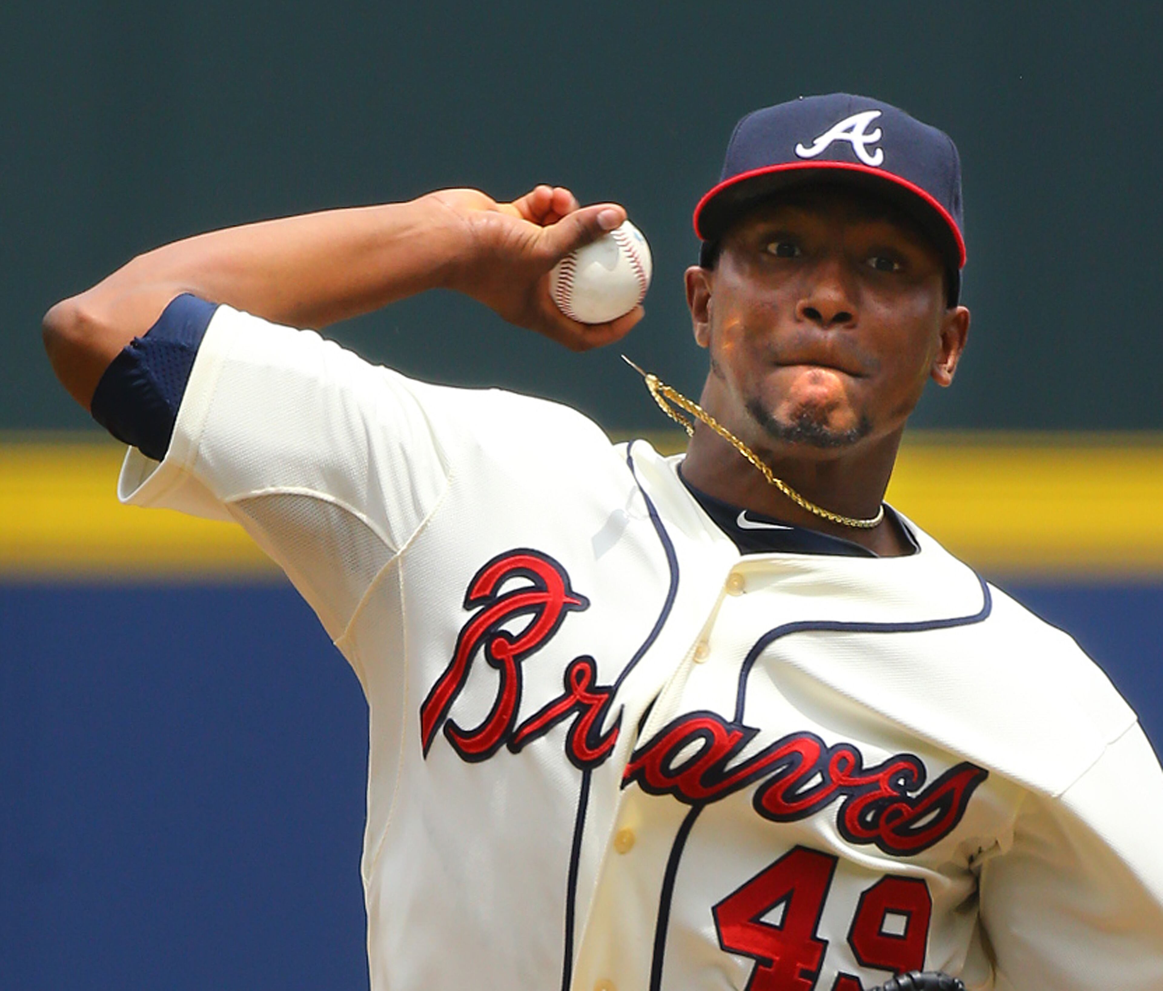 Julio Teheran, making his sixth start of the season and the 40th start of his career, delivers a pitch against the Reds during the first inning of a MLB baseball game on Sunday, April 27, 2014, in Atlanta. CURTIS COMPTON / CCOMPTON@AJC.COM
