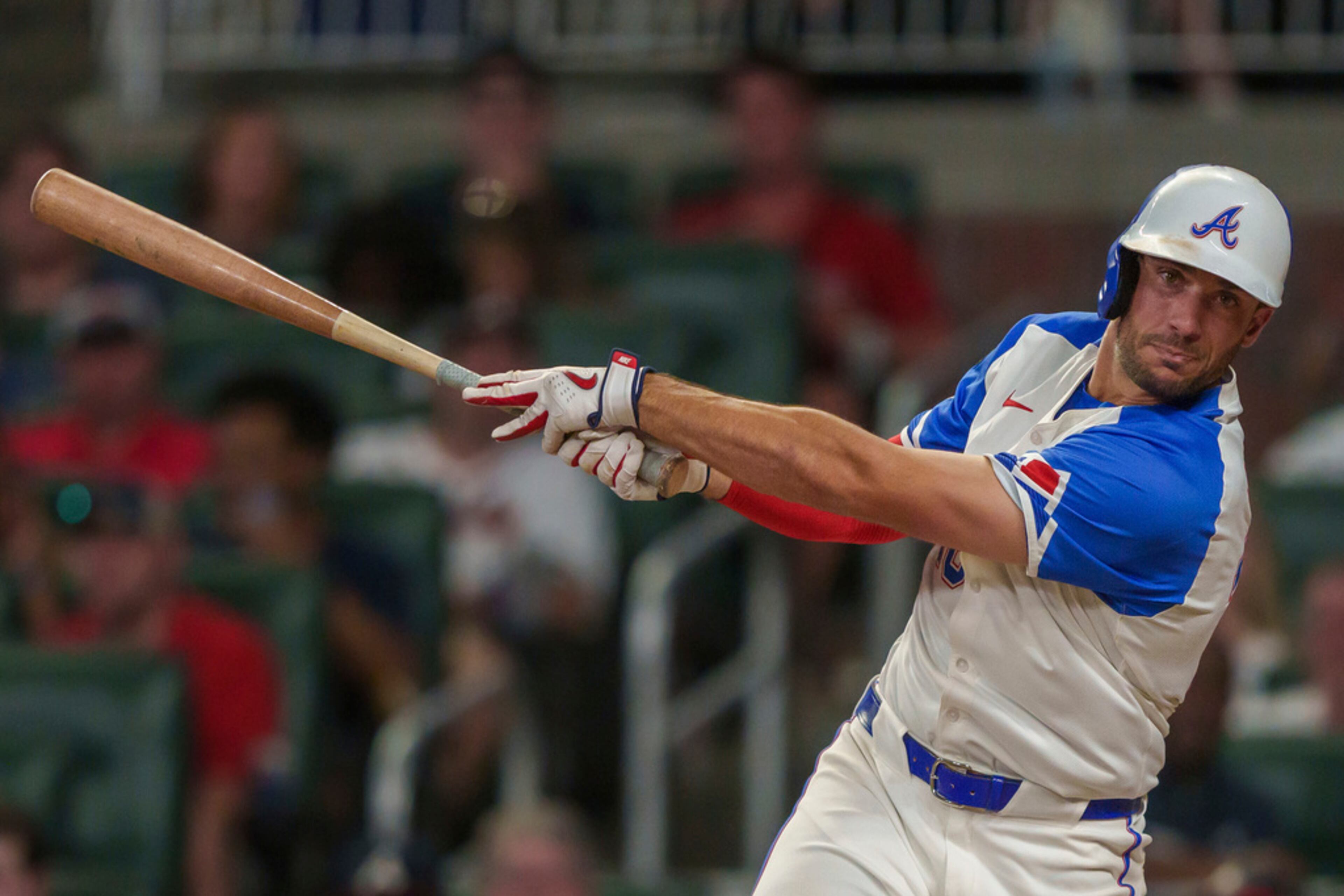 Atlanta Braves' Matt Olson (28) swings and misses in the ninth inning of a baseball game against the Miami Marlins, Saturday, Aug. 3, 2024, in Atlanta. (AP Photo/Jason Allen)