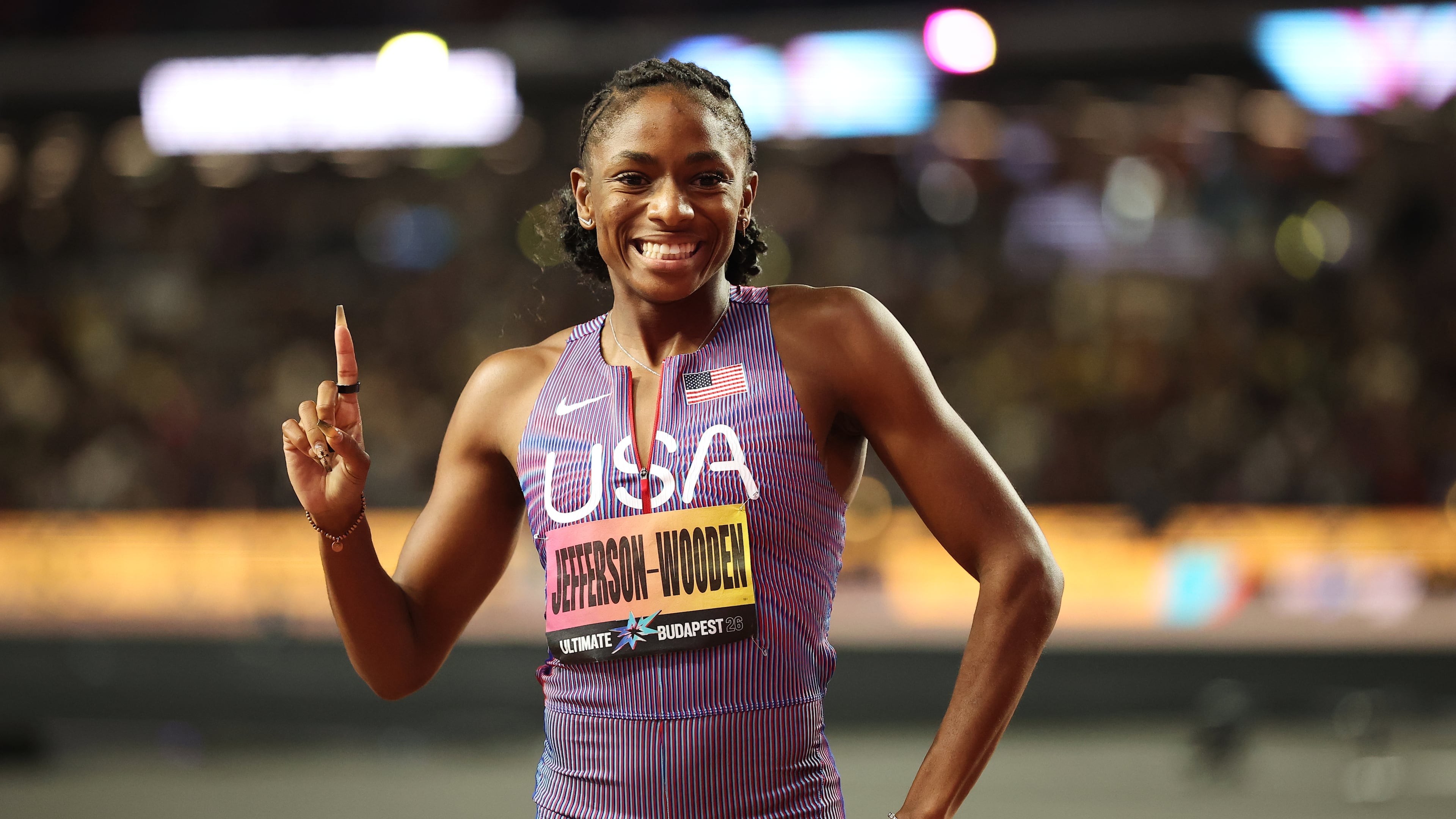 Melissa Jefferson-Wooden, of the United States, celebrates after winning the women's 100 meters final and posting a world-leading time during the World Athletics Ultimate Championship in Budapest, Hungary, Saturday, Sept. 12, 2026. (AP Photo/Armin Durgut)