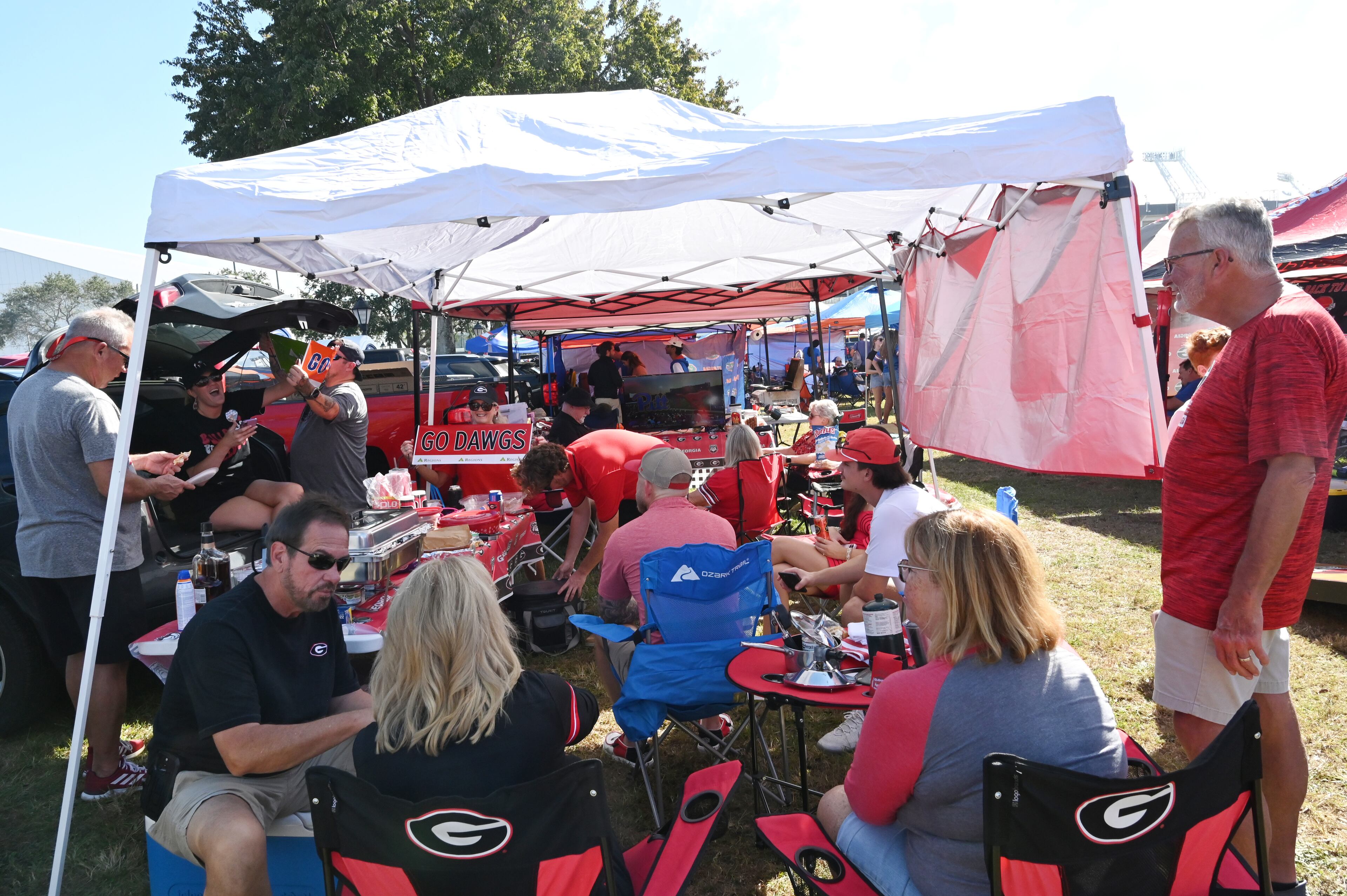 Georgia fans enjoy tailgating outside EverBank Stadium ahead of the NCAA football game between Georgia and Florida, Saturday, November 2, 2024, in Jacksonville, Fla. (Hyosub Shin / AJC)