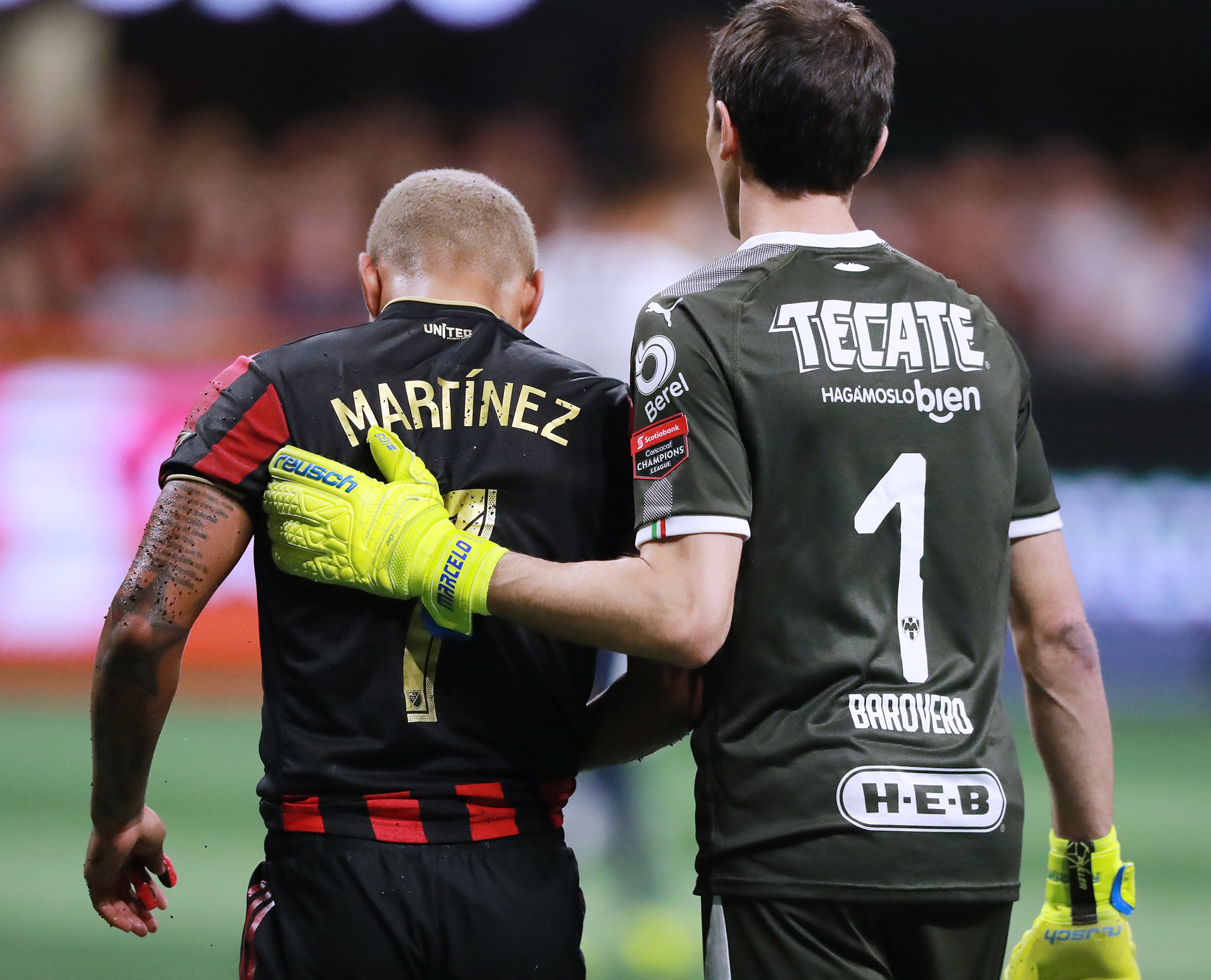 Atlanta United forward Josef Martinez gets a pat on the back from Monterrey goalkeeper Marcelo Barovero. Curtis Compton/ccompton@ajc.com