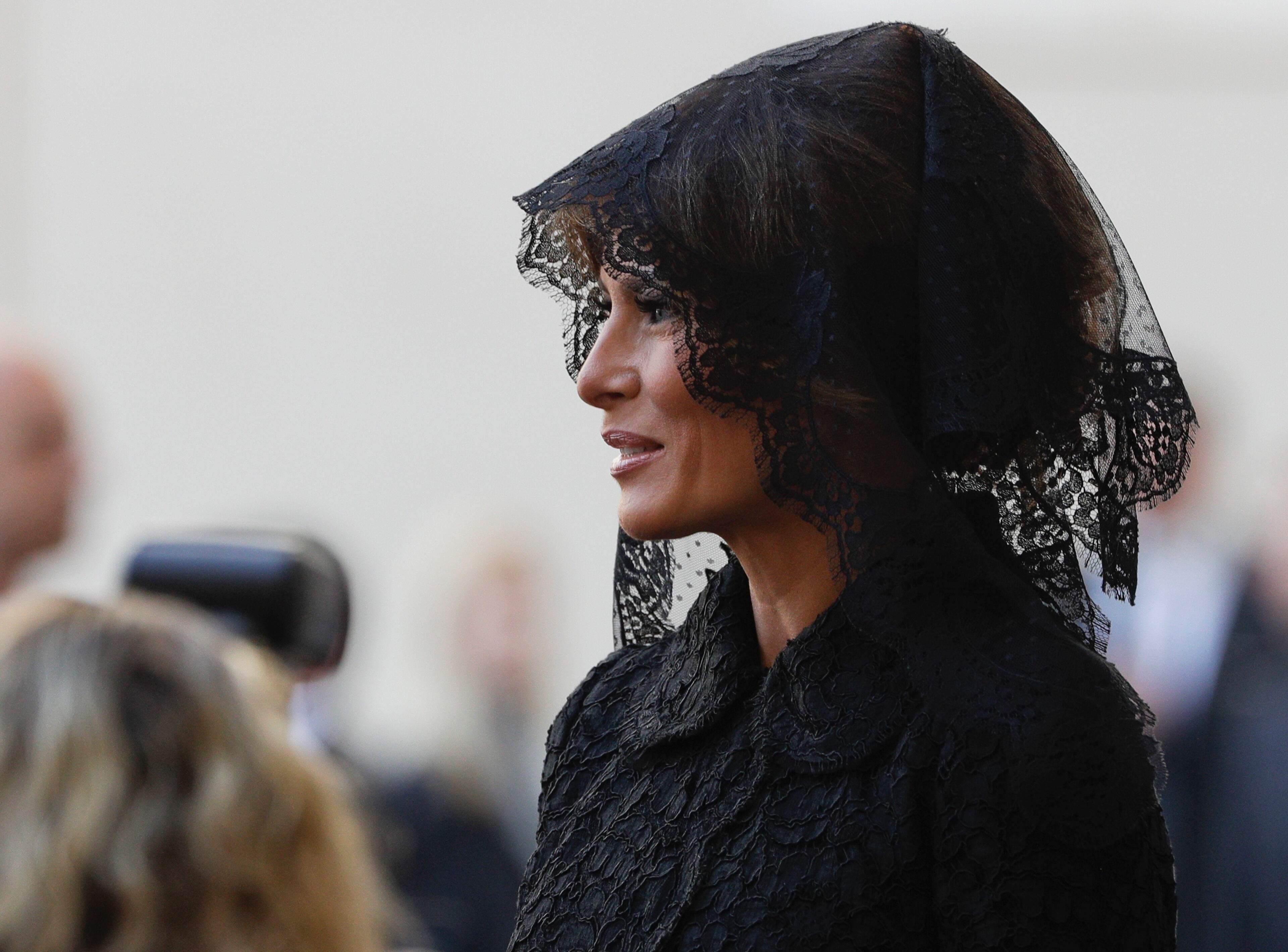 First lady Melania Trump smiles as she arrives at the San Damaso courtyard for her private audience with Pope Francis, at the Vatican, Wednesday, May 24, 2017. (AP Photo/Gregorio Borgia)