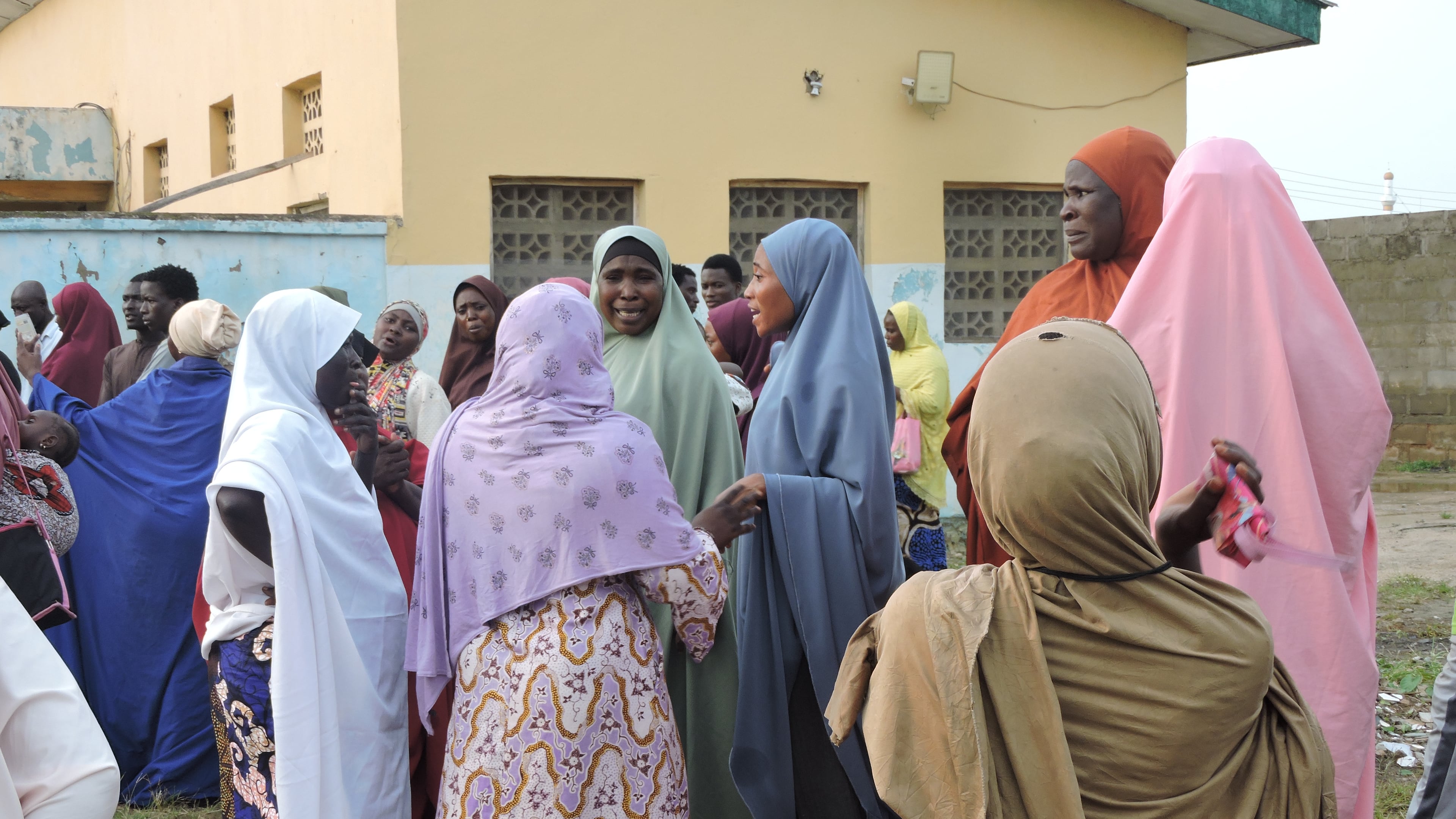 Families and relatives of miners who were arrested on suspicion of illegal mining wait outside a hospital where their bodies are stored in Minna, Nigeria, Thursday, Sept. 17, 2026. (AP Photo/Muhammed Nura)
