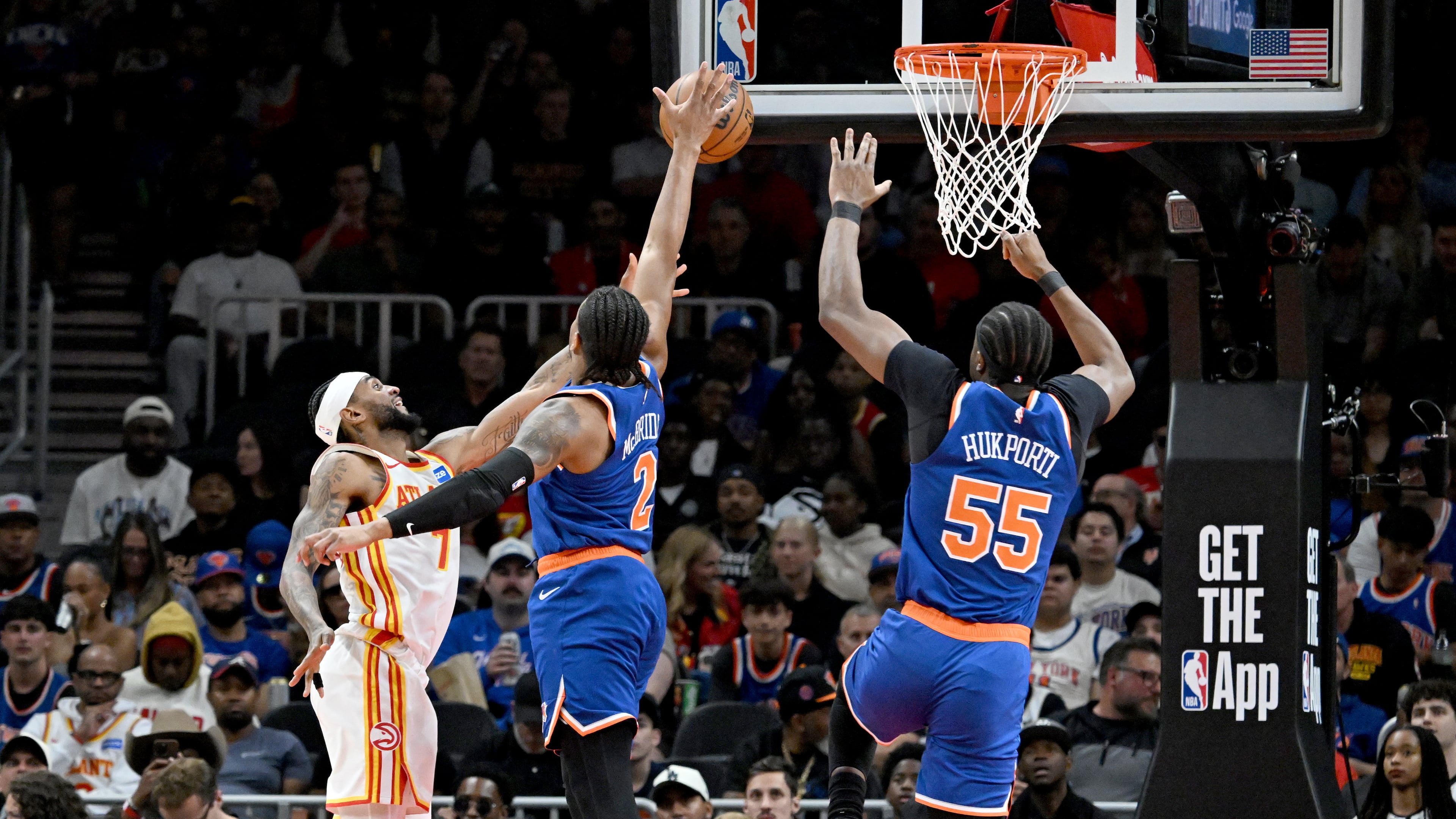 Knicks guard Miles McBride blocks a shot attempt by Hawks guard Nickeil Alexander-Walker during the second half of Game 6 of their first-round NBA playoff series at State Farm Arena on Thursday, April 30, 2026, in Atlanta. New York Knicks won 140-89 over Atlanta Hawks. (Hyosub Shin/AJC)