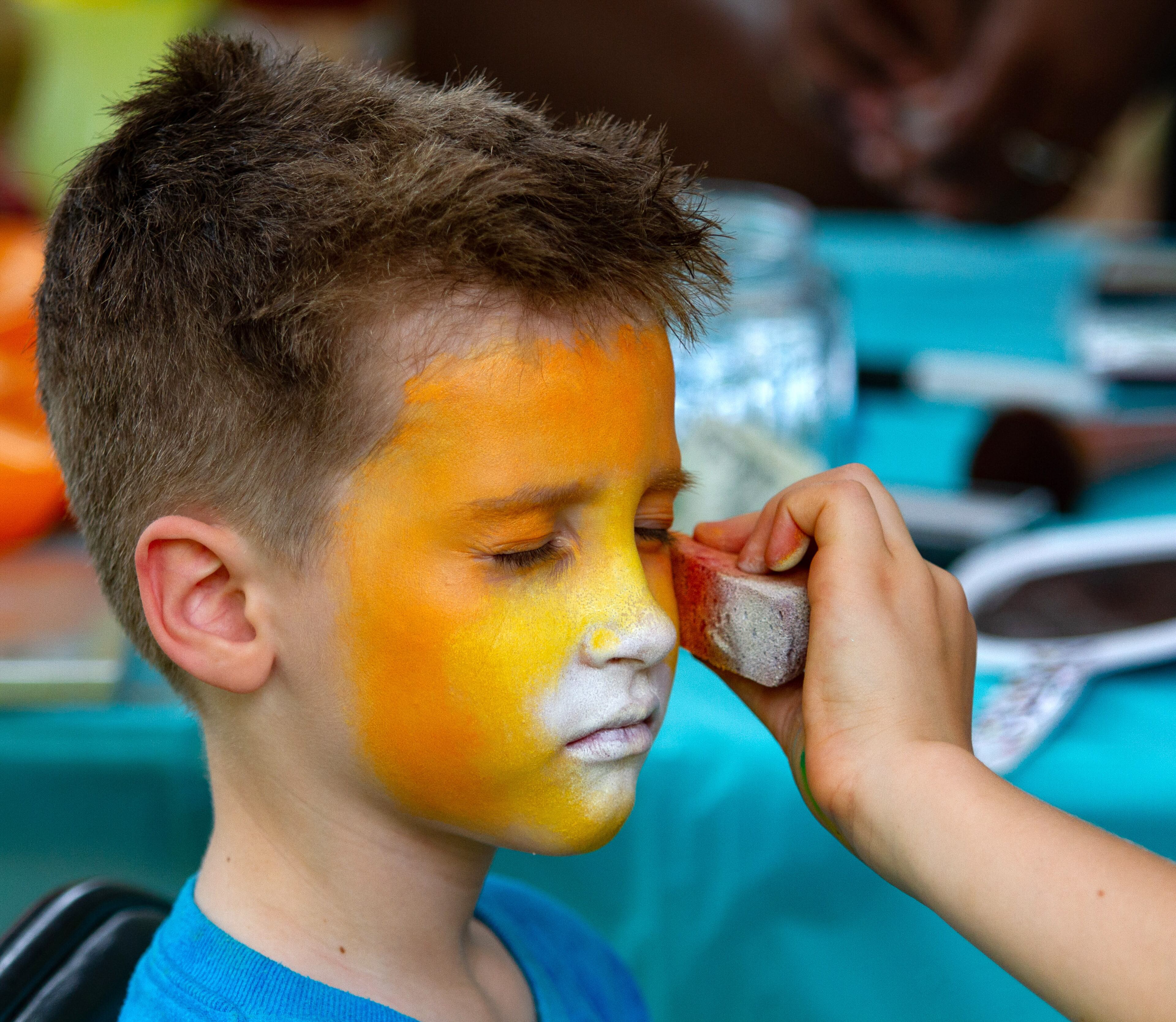 Fletcher McKenzie has his face painted like a lion during the 19th annual Decatur BBQ Blues & Bluegrass festival on Saturday, August 10, 2019. STEVE SCHAEFER / SPECIAL TO THE AJC
