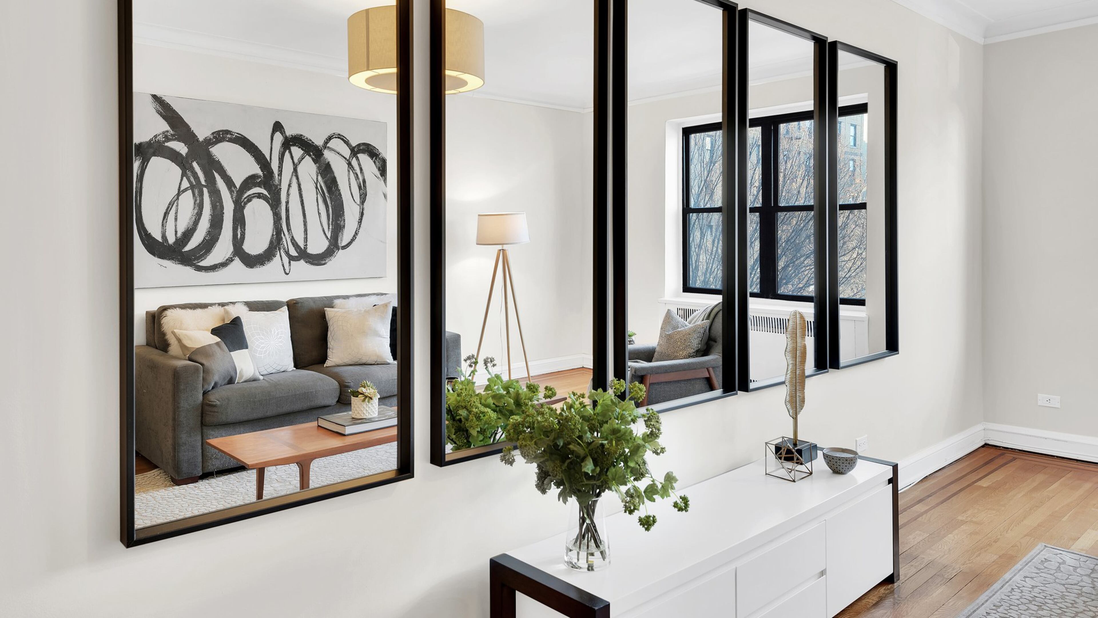 Simple mirrors in a series can be an affordable solution to traditional artwork. (Design Recipes)