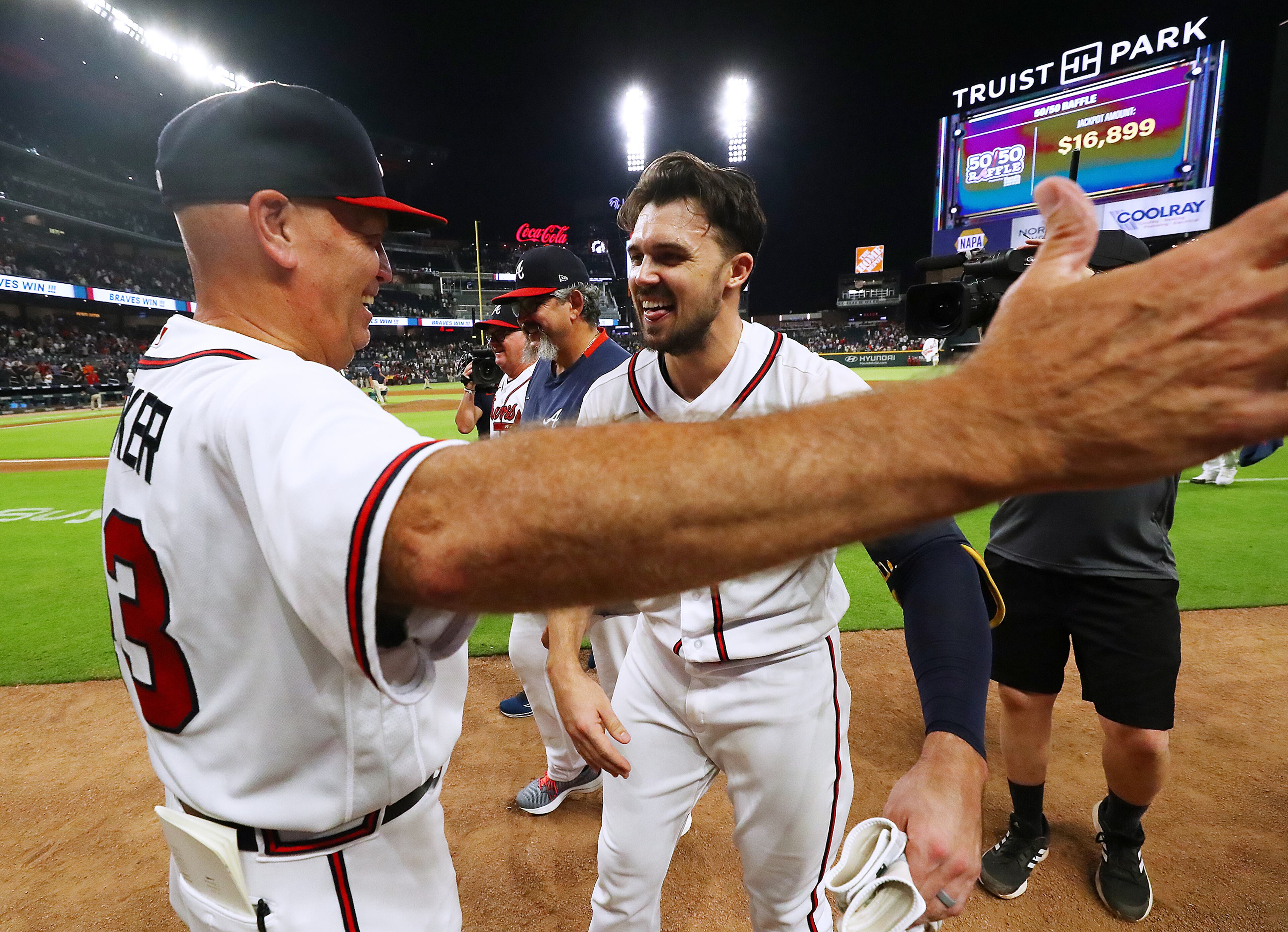 Braves outfielder Adam Duvall celebrates his walk-off RBI single while getting a hug from manager Brian Snitker on Wednesday, June 22, 2022, in Atlanta. “Curtis Compton / Curtis.Compton@ajc.com”