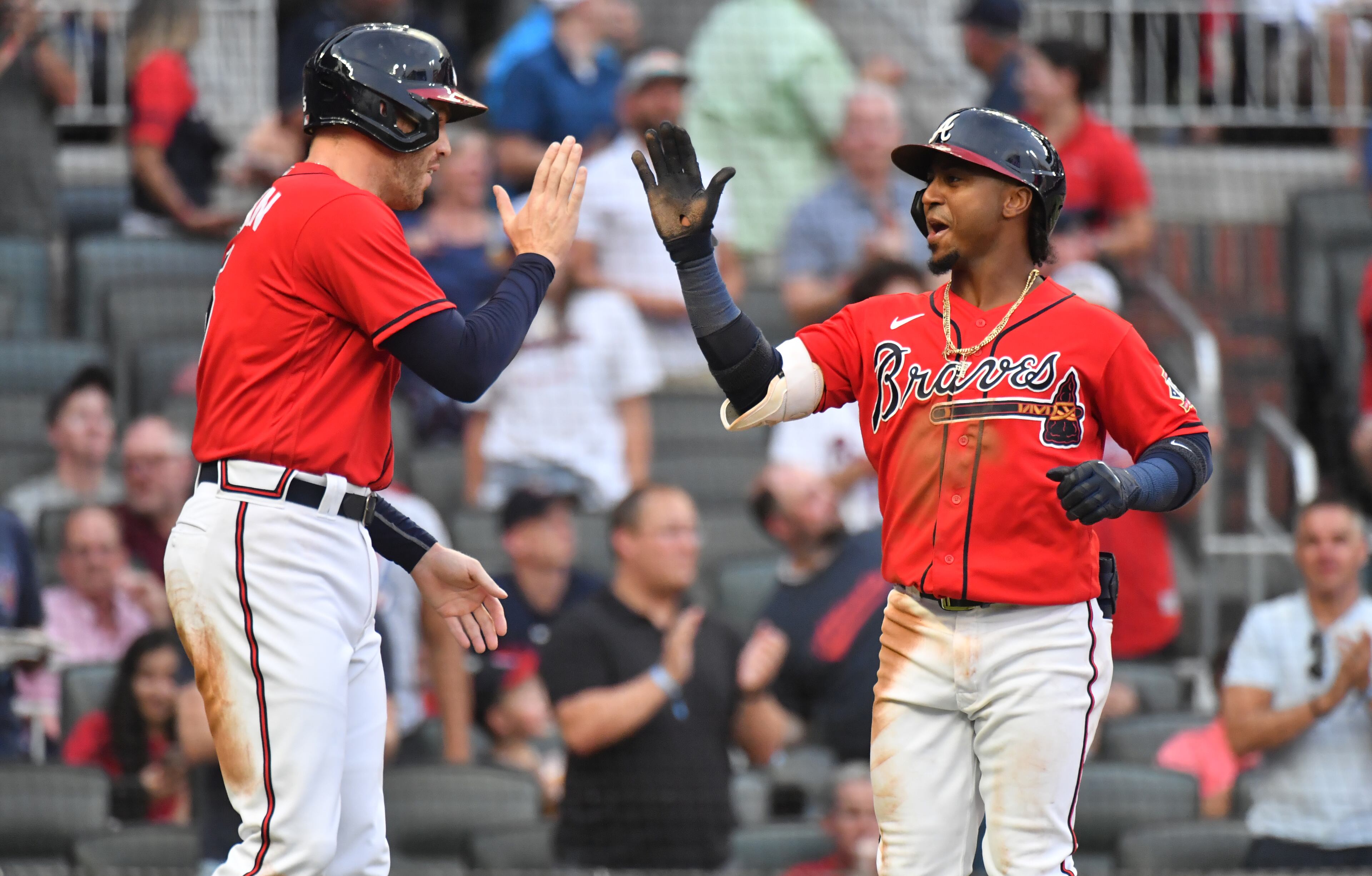 Braves second baseman Ozzie Albies (right) celebrates with first baseman Freddie Freeman (5) after hitting a home run in the second inning at Truist Park on Friday, June 18, 2021. (Hyosub Shin / Hyosub.Shin@ajc.com)