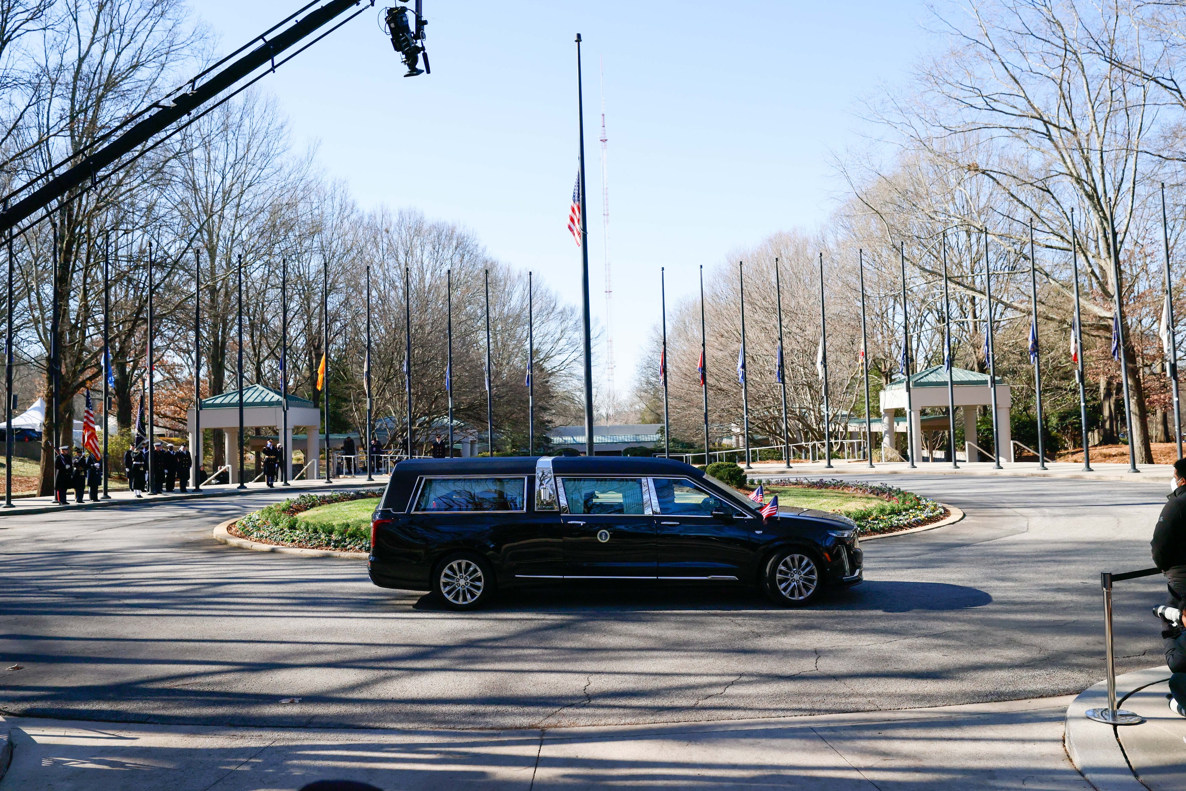 The hearse carrying the remains of President Jimmy Carter left the Jimmy Carter Presidential Center to continue his State Funeral, traveling to Washington, D.C., on Tuesday,
(Miguel Martinez/AJC)