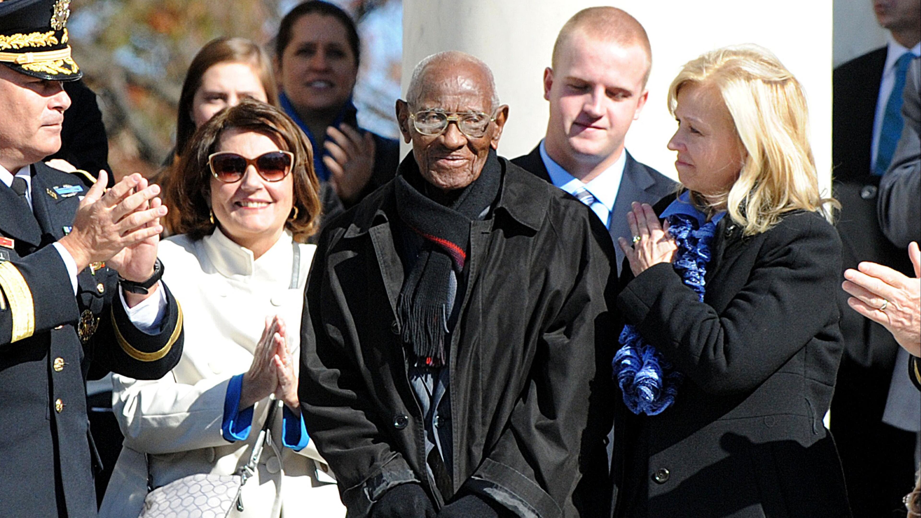 Richard Overton, center, was honored at Arlington National Cemetery by President Barack Obama in 2013.