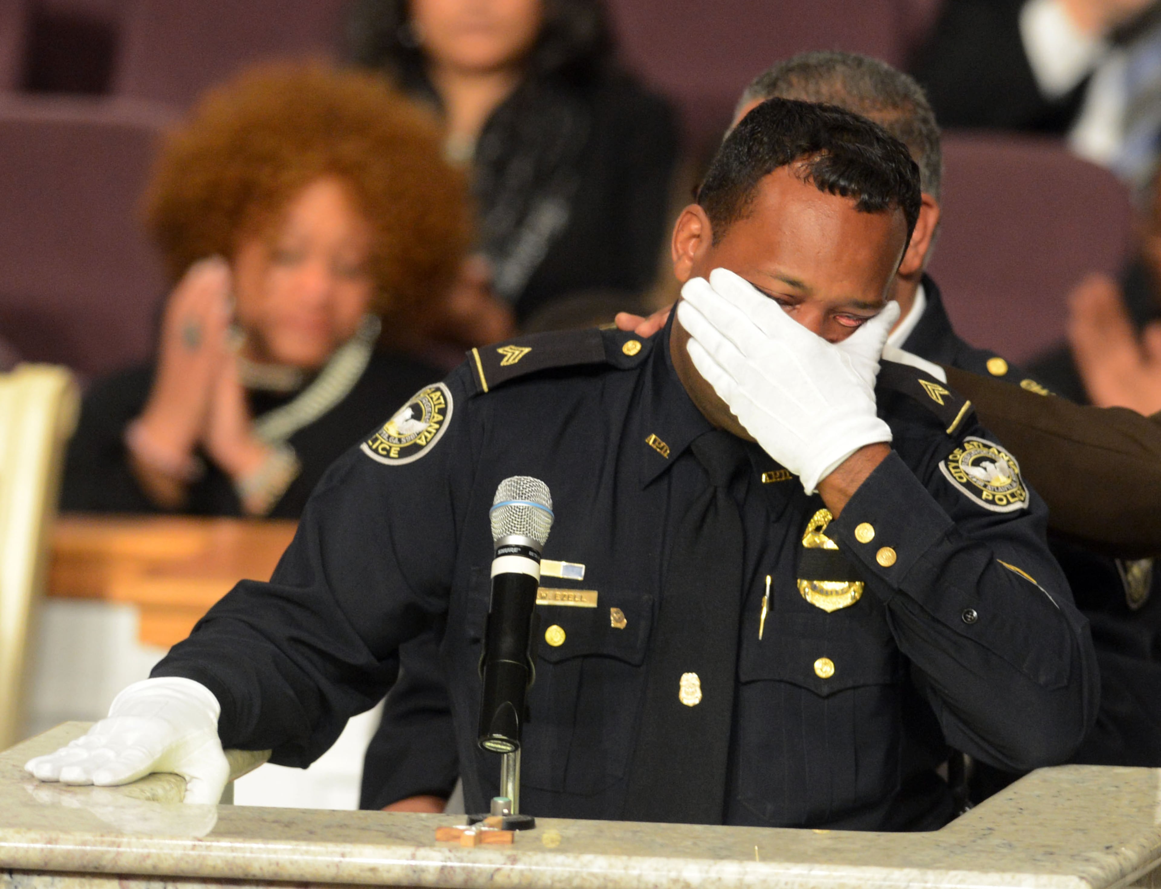 Childhood friend and fellow APD officer Sgt. Archie Ezell is overcome by emotion as he tells the audience, "he was bigger than life." He and Halford met as 13 year old boys while playing football in Columbus, Ga.