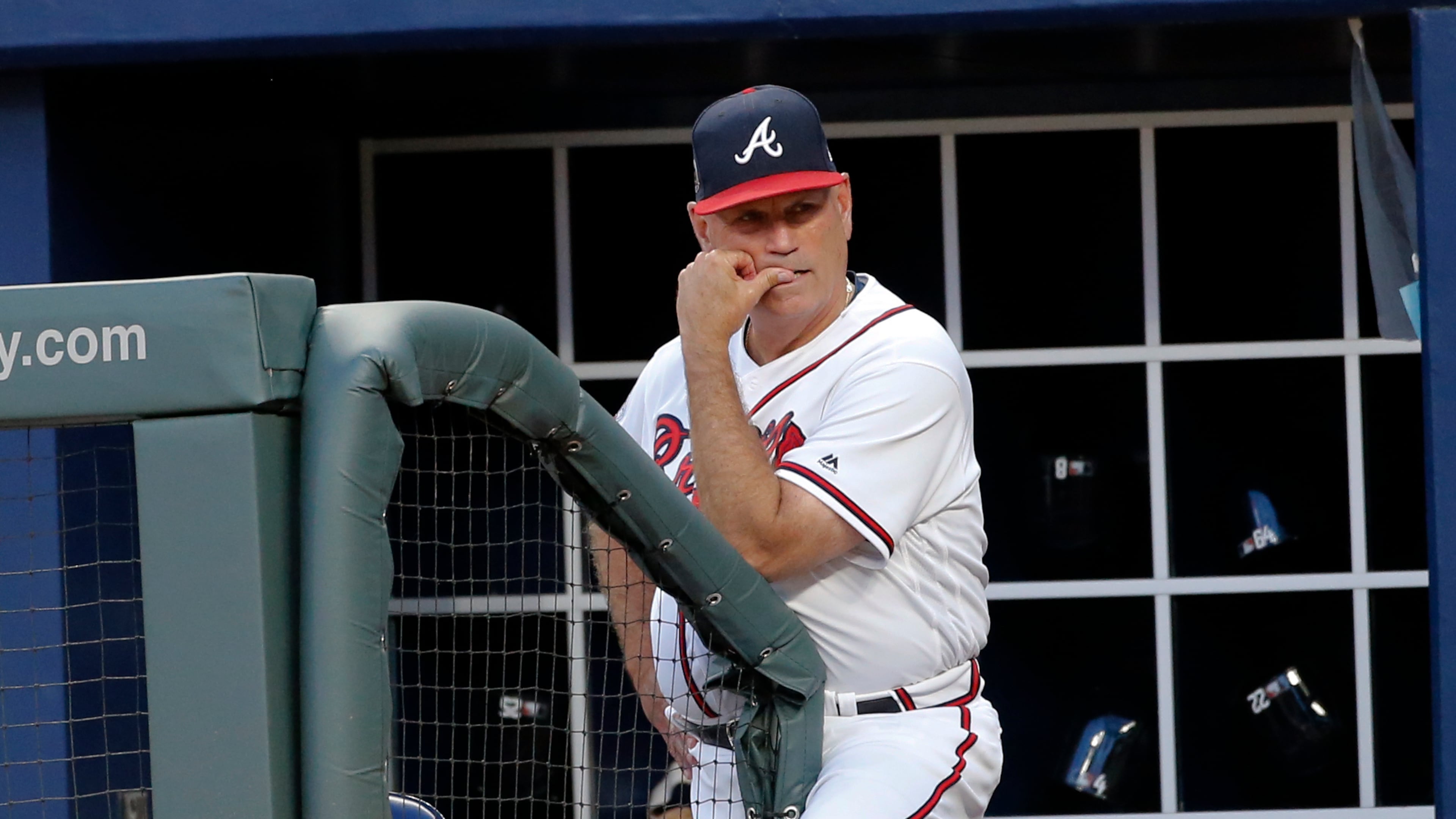 Braves manager Brian Snitker looks out from the dugout during Tuesday’s game against the Pirates. (AP Photo/John Bazemore)