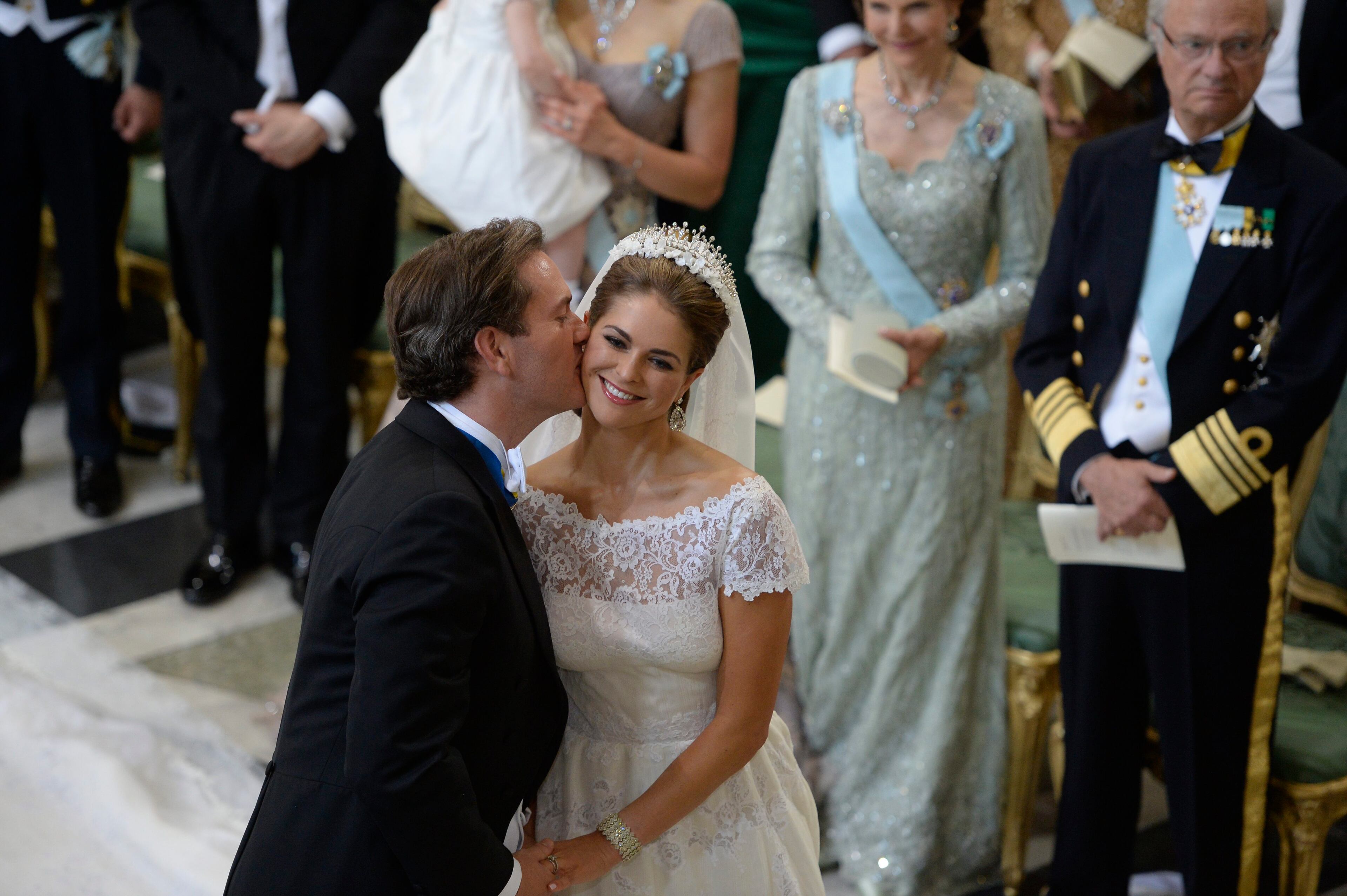 Christopher O'Neill kisses Princess Madeleine of Sweden at their wedding ceremony at the Royal Chapel in Stockholm, Saturday June 8, 2013. (AP Photo/Jessica Gow)