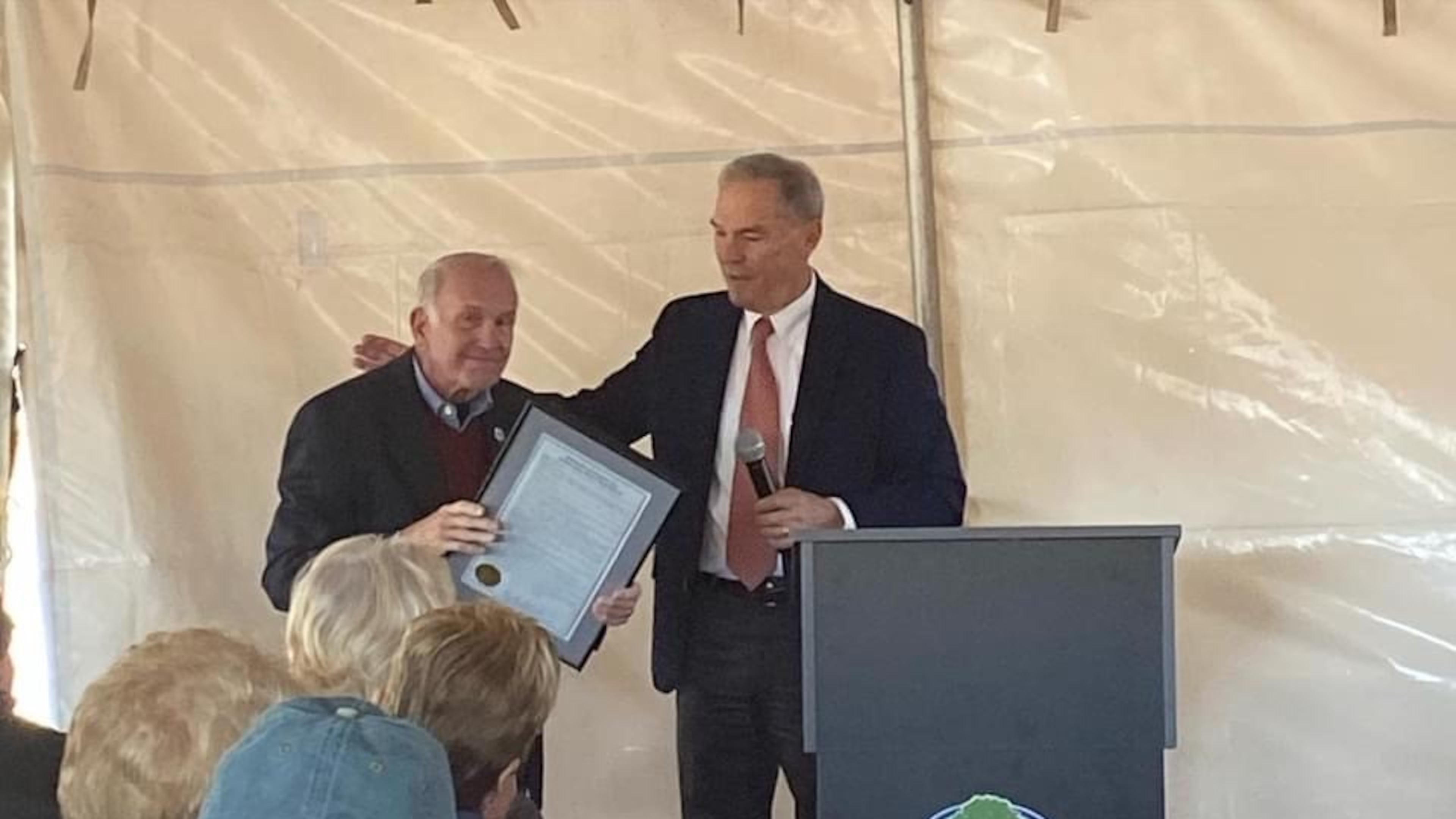Upon the opening of "The Buzz" recreation center in his honor, former Cherokee County Board of Commissioners Chairman L.B. "Buzz" Ahrens Jr. (l) received a proclamation from Cherokee BOC Chairman Harry B. Johnston. (Courtesy of Cherokee County)