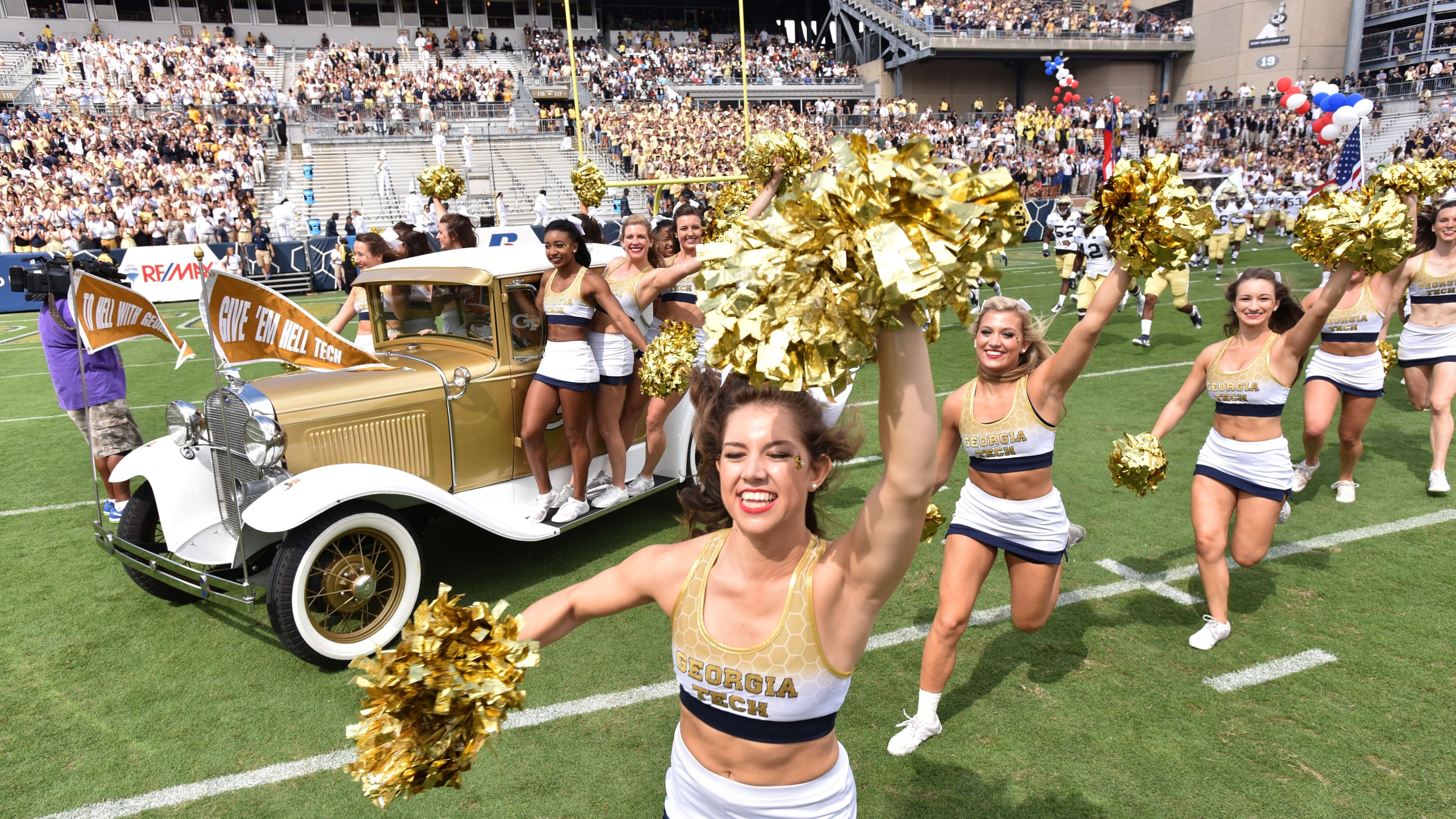 The Ramblin’ Wreck enters Bobby Dodd Stadium. (HYOSUB SHIN / HSHIN@AJC.COM)