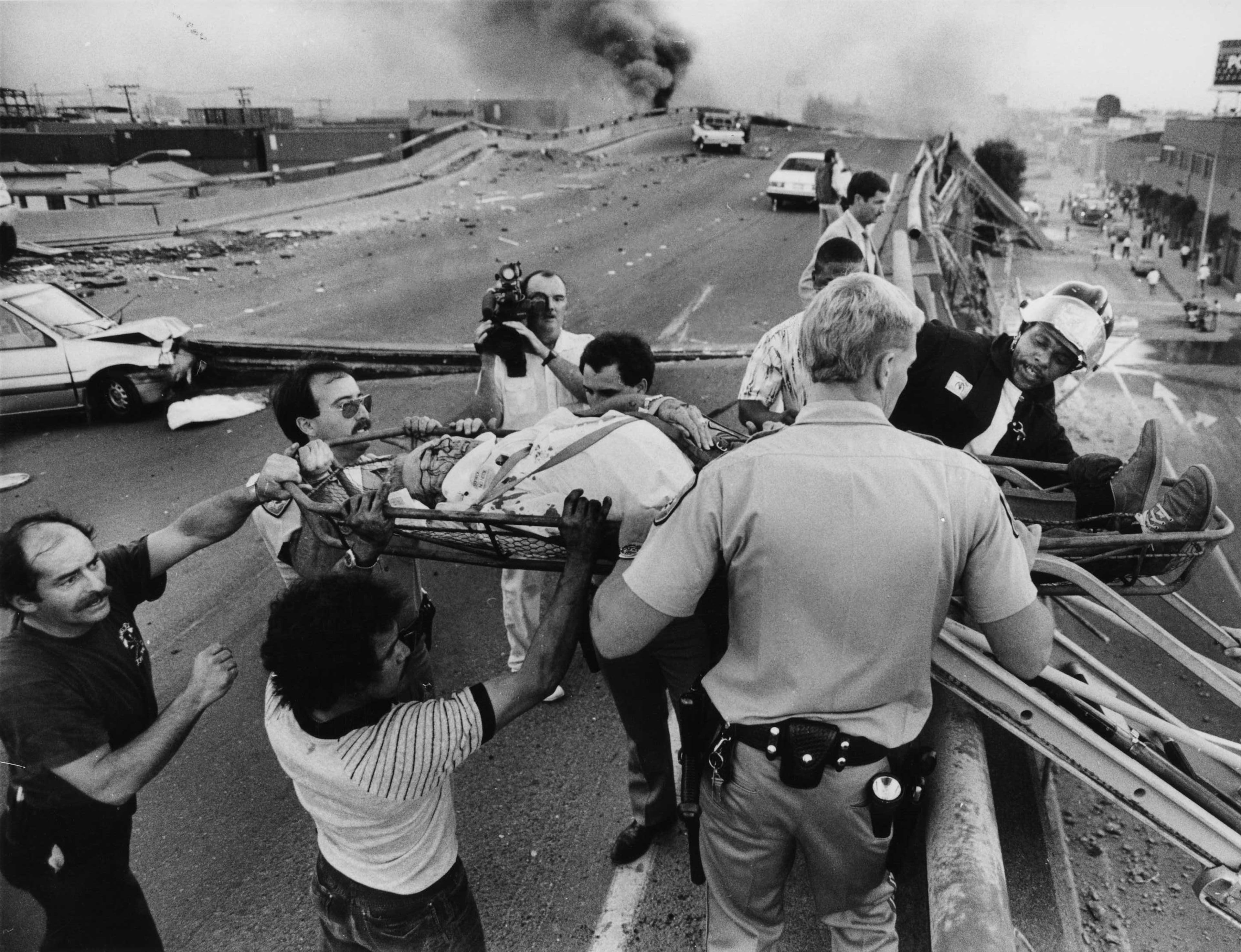 FILE: In this file photo taken Oct. 17, 1989, medical personal attend to a victim of the Cypress Freeway collapse in Oakland, Calif., after the Loma Prieta earthquake. Friday is the 25th anniversary of the Loma Prieta earthquake that killed 63 people, injured almost 3,800 and caused up to $10 billion damage. (AP Photo/Michael Macor, The Oakland Tribune)