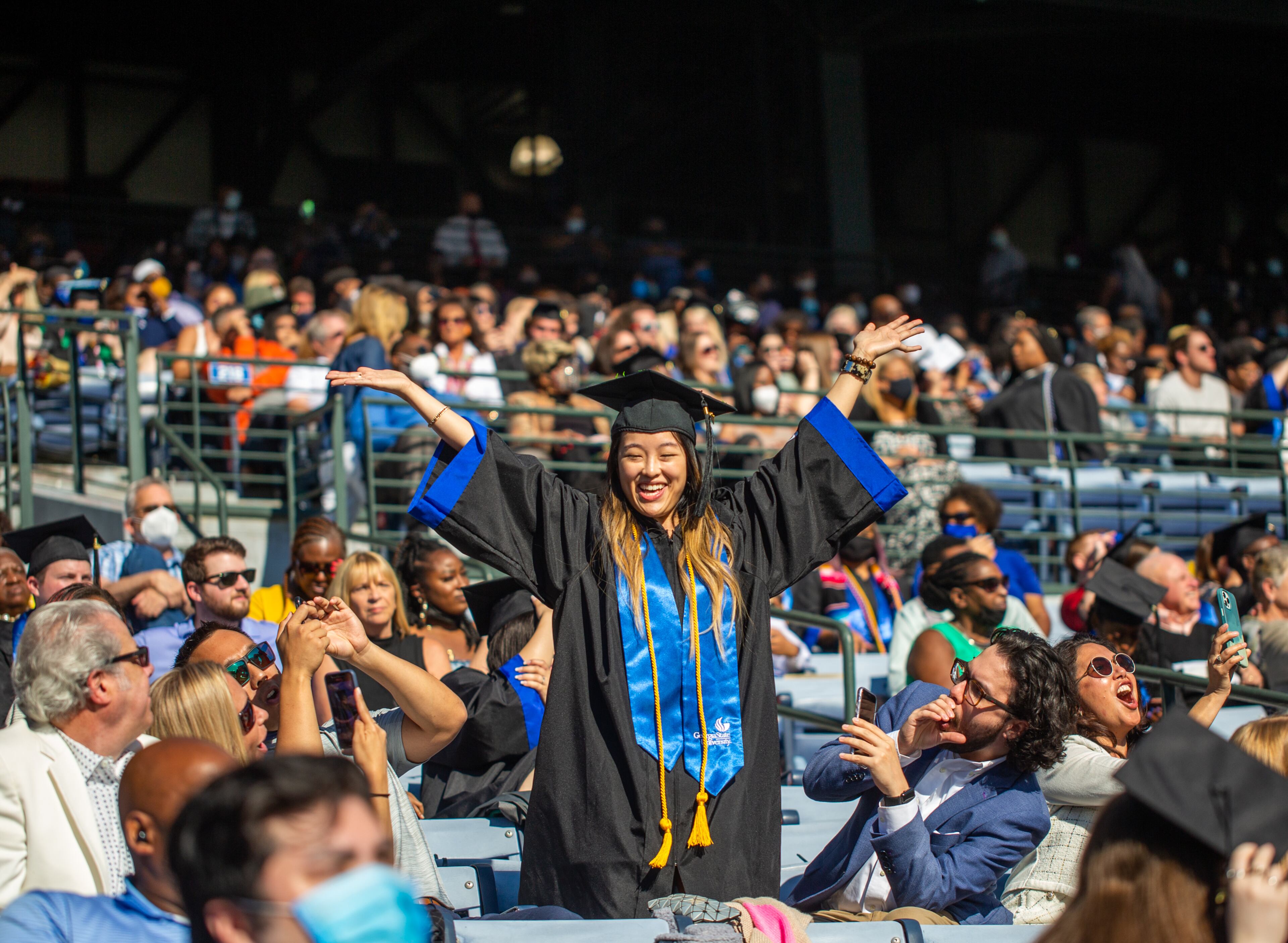 Vivian Chang celebrates as her name read after earning her elementary education degree from Georgia State University during graduation at Center Parc Stadium on Thursday, May 6, 2021. GSU graduated 5000 students this year. (Jenni Girtman for The Atlanta Journal - Constitution)