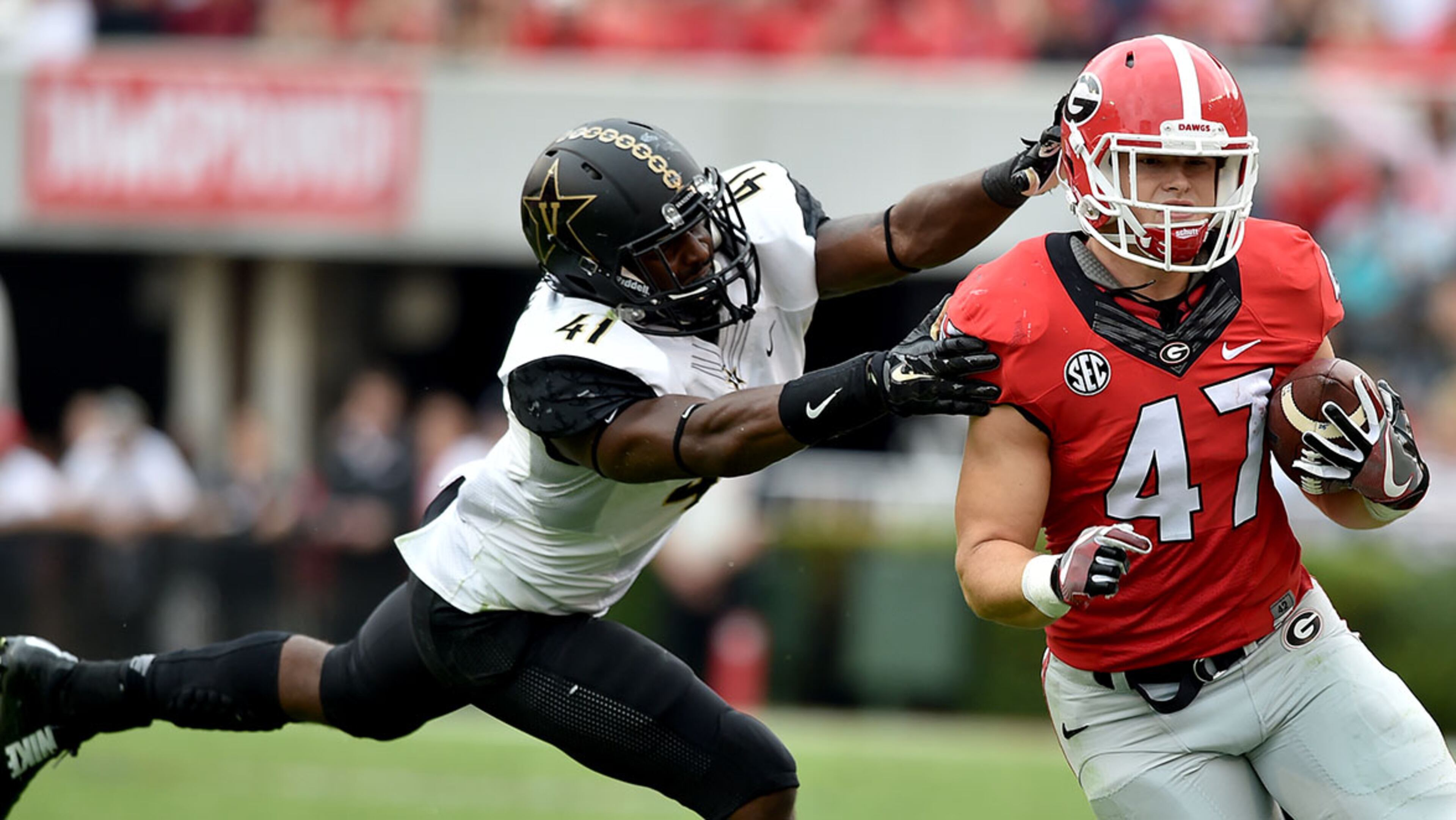 October 15, 2016 Athens, GA: Georgia Bulldogs fullback Christian Payne tries to elude the tackle of Vanderbilt Commodores linebacker Zach Cunningham during the 3rd quarter at Sanford Stadium Saturday October 15, 2016. BRANT SANDERLIN/BSANDERLIN@AJC.COM