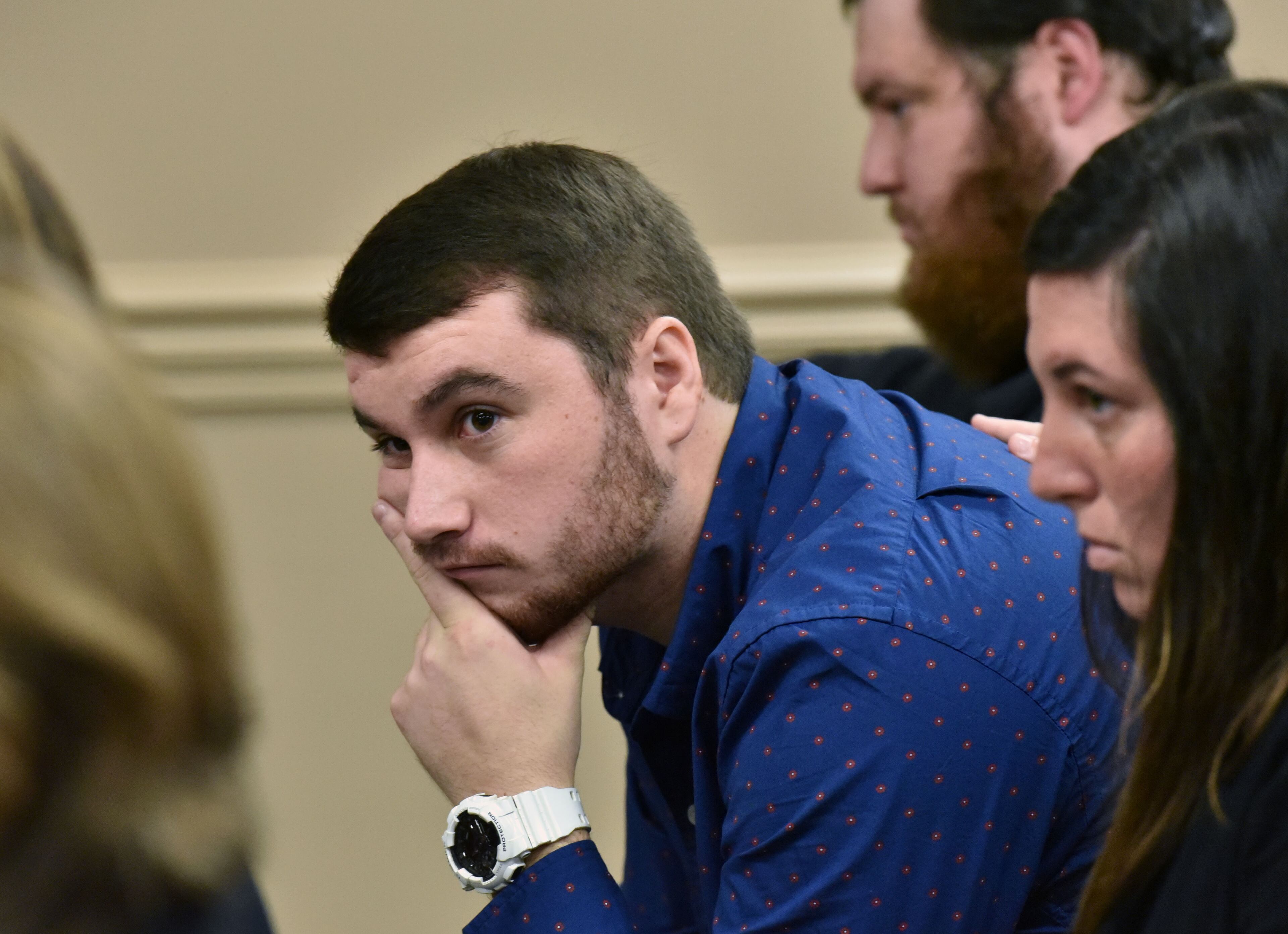Dakota Brookshire (center) sits with brother Brandon Brookshire (background) and sister Kayla Gissendaner (foreground) before the hearing to ask parole board to reconsider Gissendaner's clemency request at The State Board of Pardons and Paroles on Tuesday, September 29, 2015. HYOSUB SHIN / HSHIN@AJC.COM