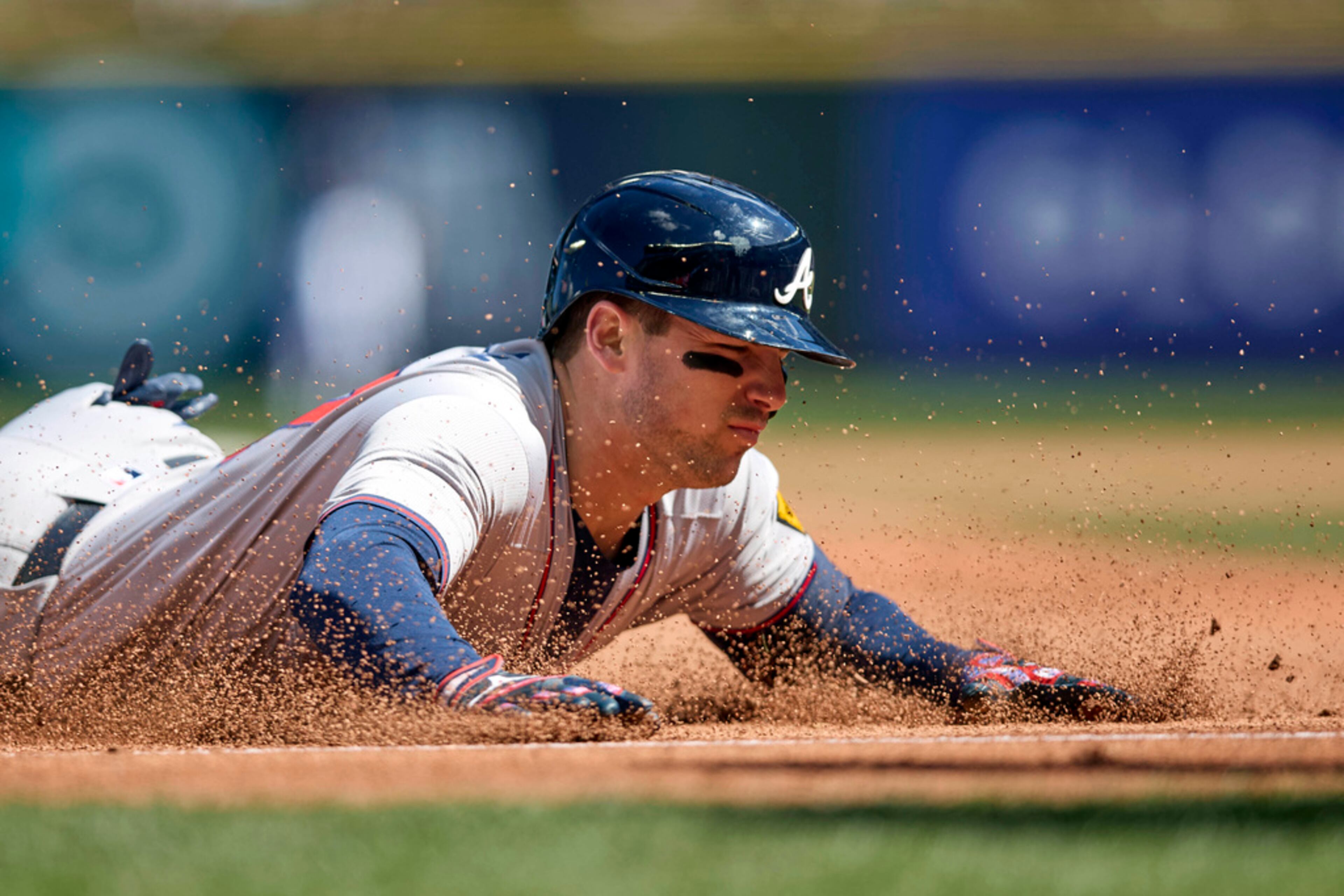 Atlanta Braves' Austin Riley slides into third on a two RBI triple against the Seattle Mariners during the fourth inning of a baseball game, Wednesday, May 1, 2024, in Seattle. (AP Photo/John Froschauer)